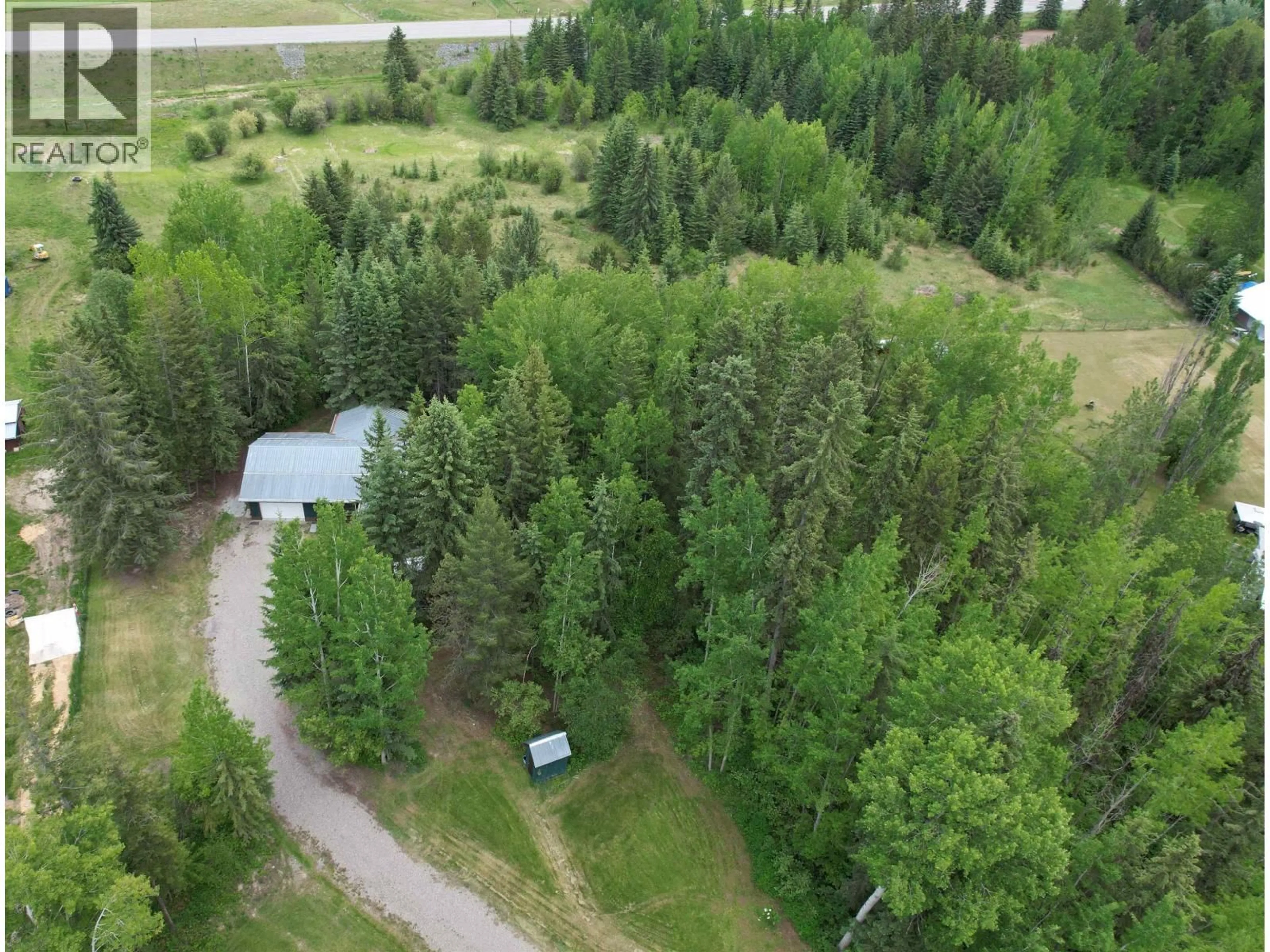 A pic from outside/outdoor area/front of a property/back of a property/a pic from drone, forest/trees view for 3416 HAYMAN CRESCENT, Quesnel British Columbia V2J6K8