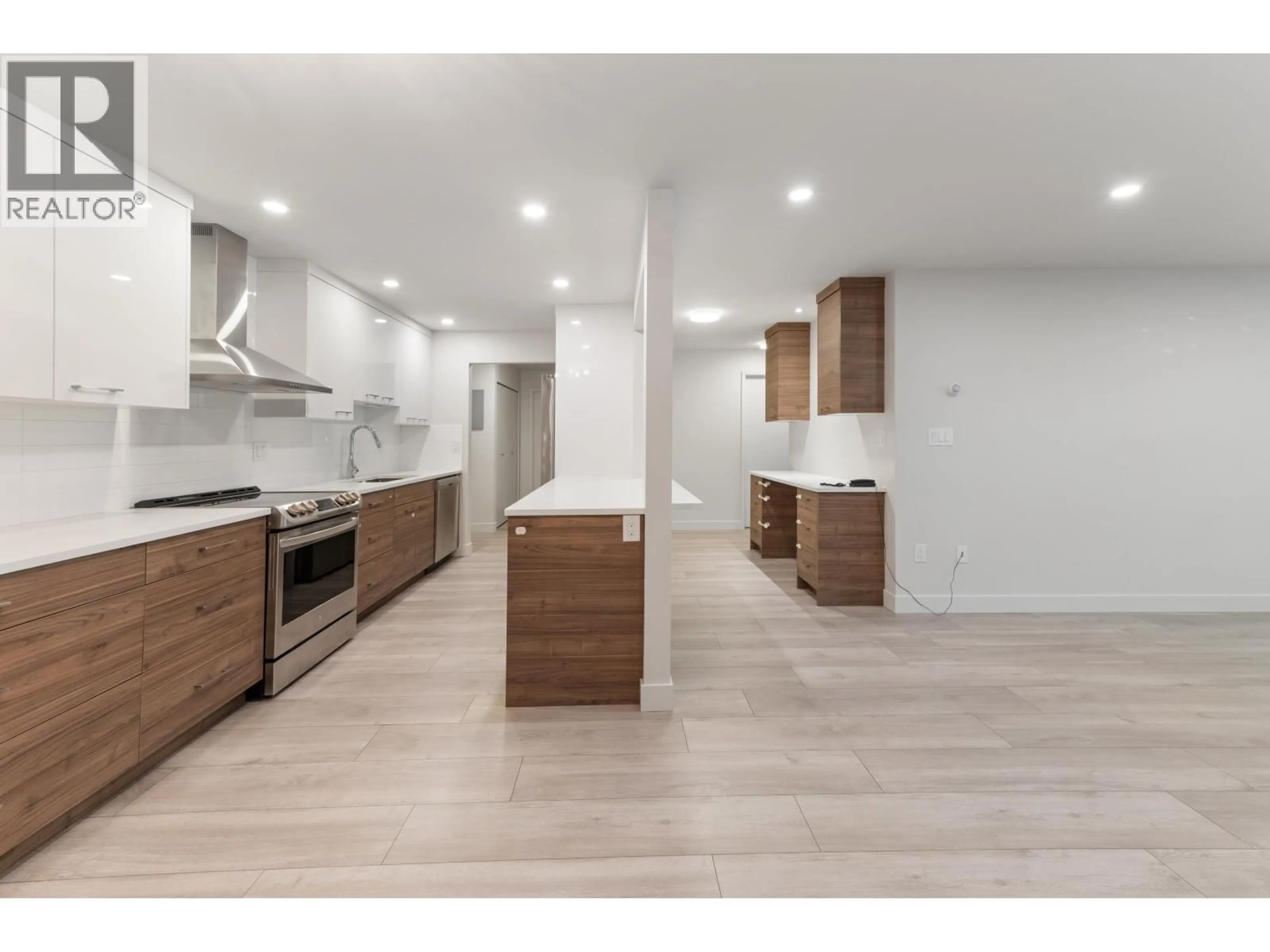 Open concept kitchen, wood/laminate floor for 212 - 2381 BURY AVENUE, Port Coquitlam British Columbia V3C1Z9