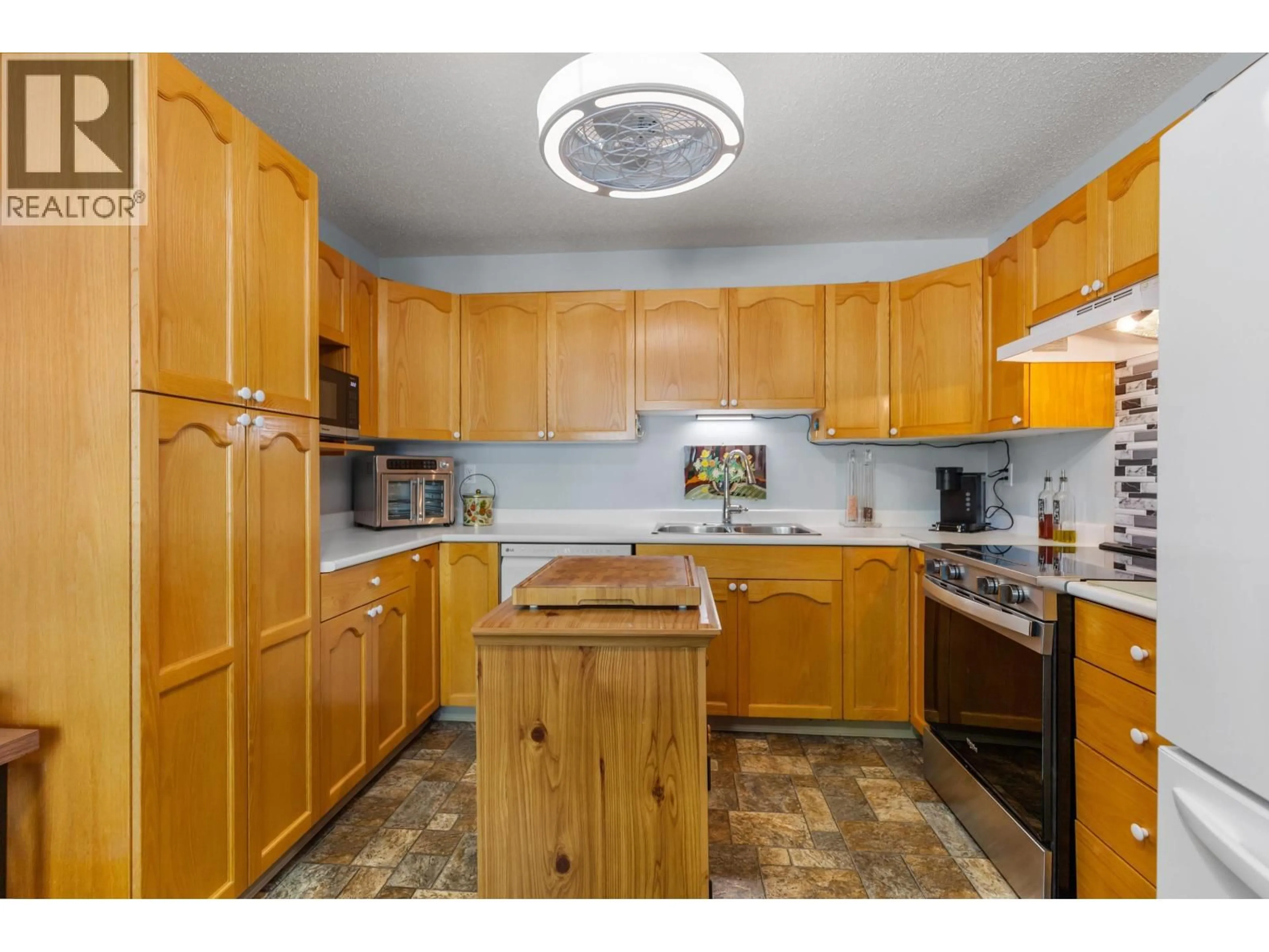 Standard kitchen, wood/laminate floor for 103 - 3233 MCGILL CRESCENT, Prince George British Columbia V2N2T4