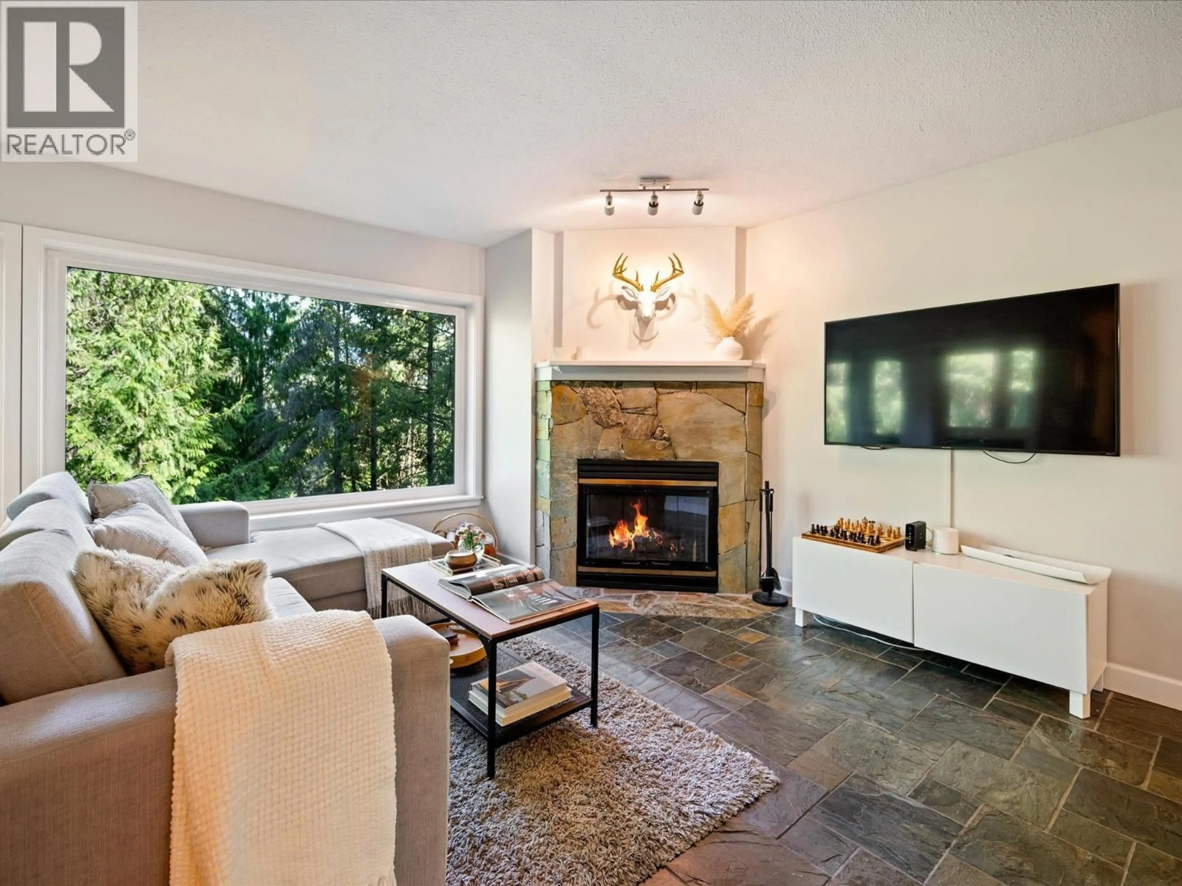 Living room with furniture, ceramic/tile floor for 1 - 2240 GONDOLA WAY, Whistler British Columbia V8E0N1