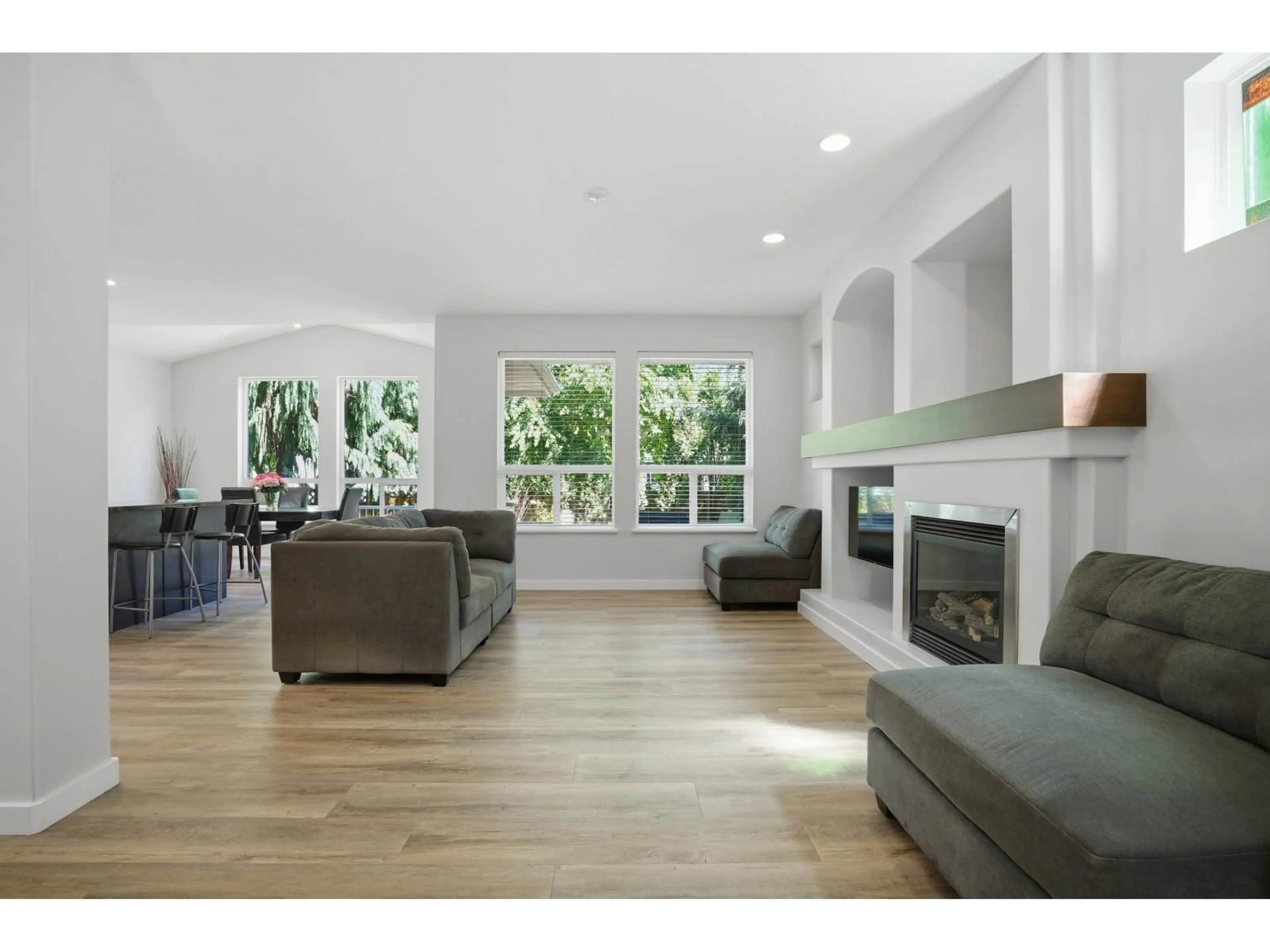 Living room with furniture, wood/laminate floor for 21163 82A AVENUE, Langley British Columbia V2Y0B5