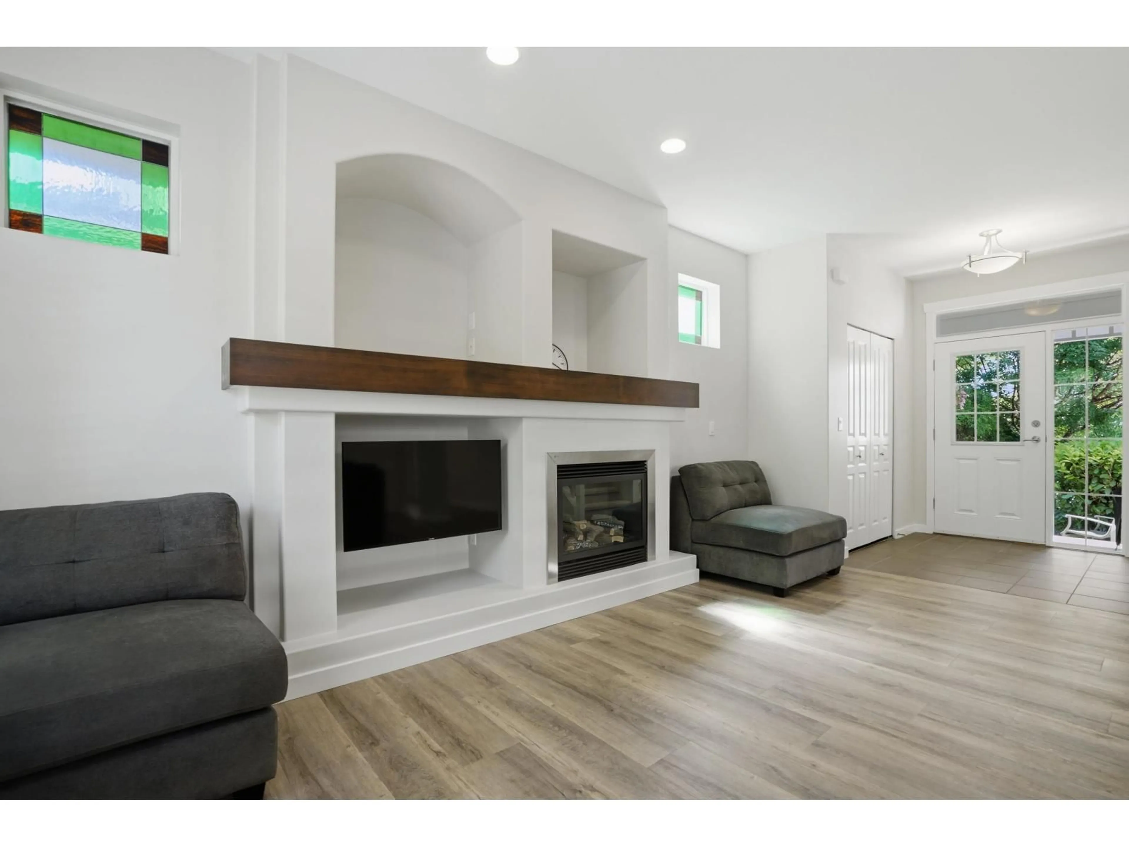 Living room with furniture, wood/laminate floor for 21163 82A AVENUE, Langley British Columbia V2Y0B5