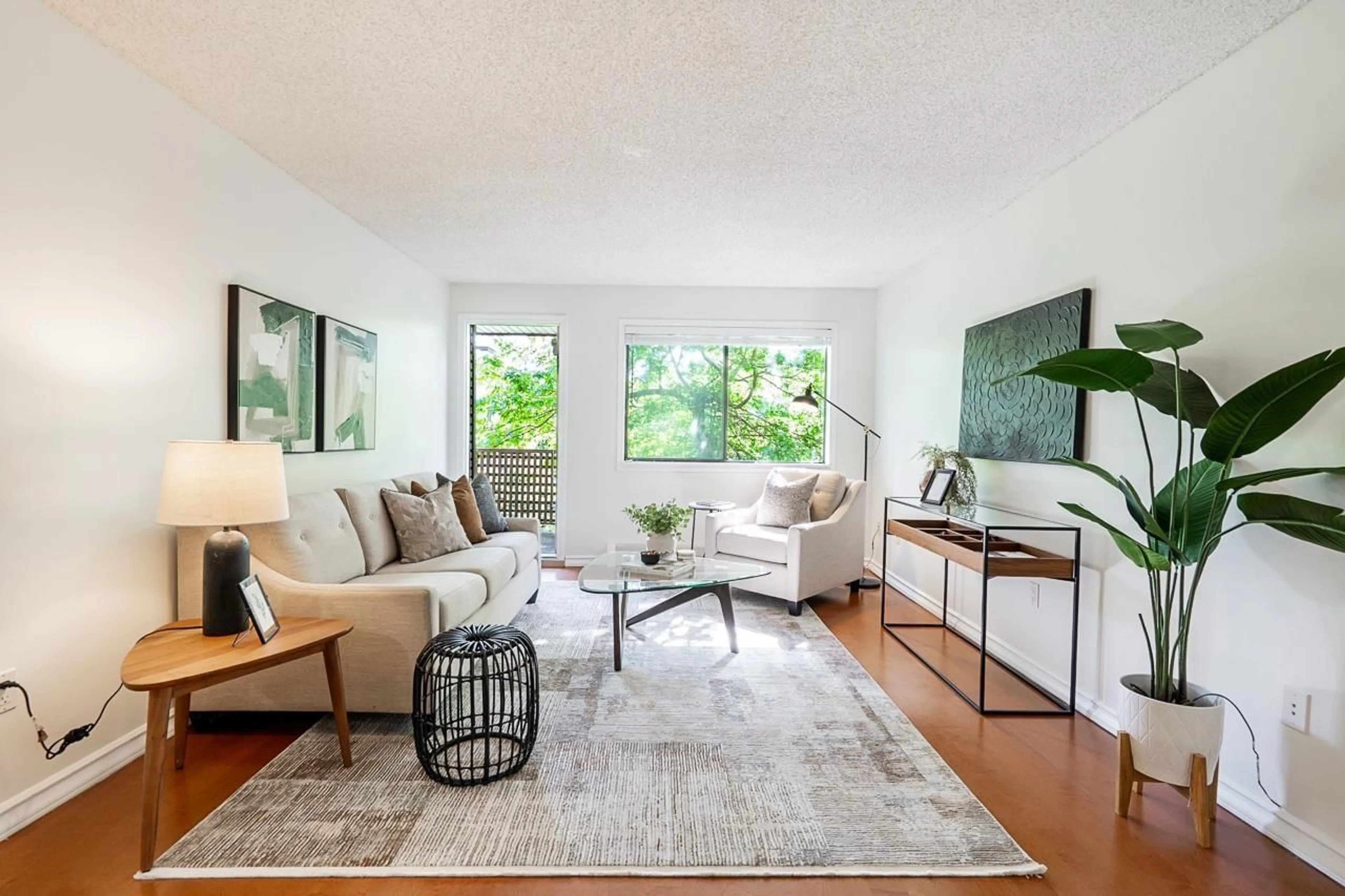 Living room with furniture, wood/laminate floor for 306 - 10680 151A STREET, Surrey British Columbia V3R8T4