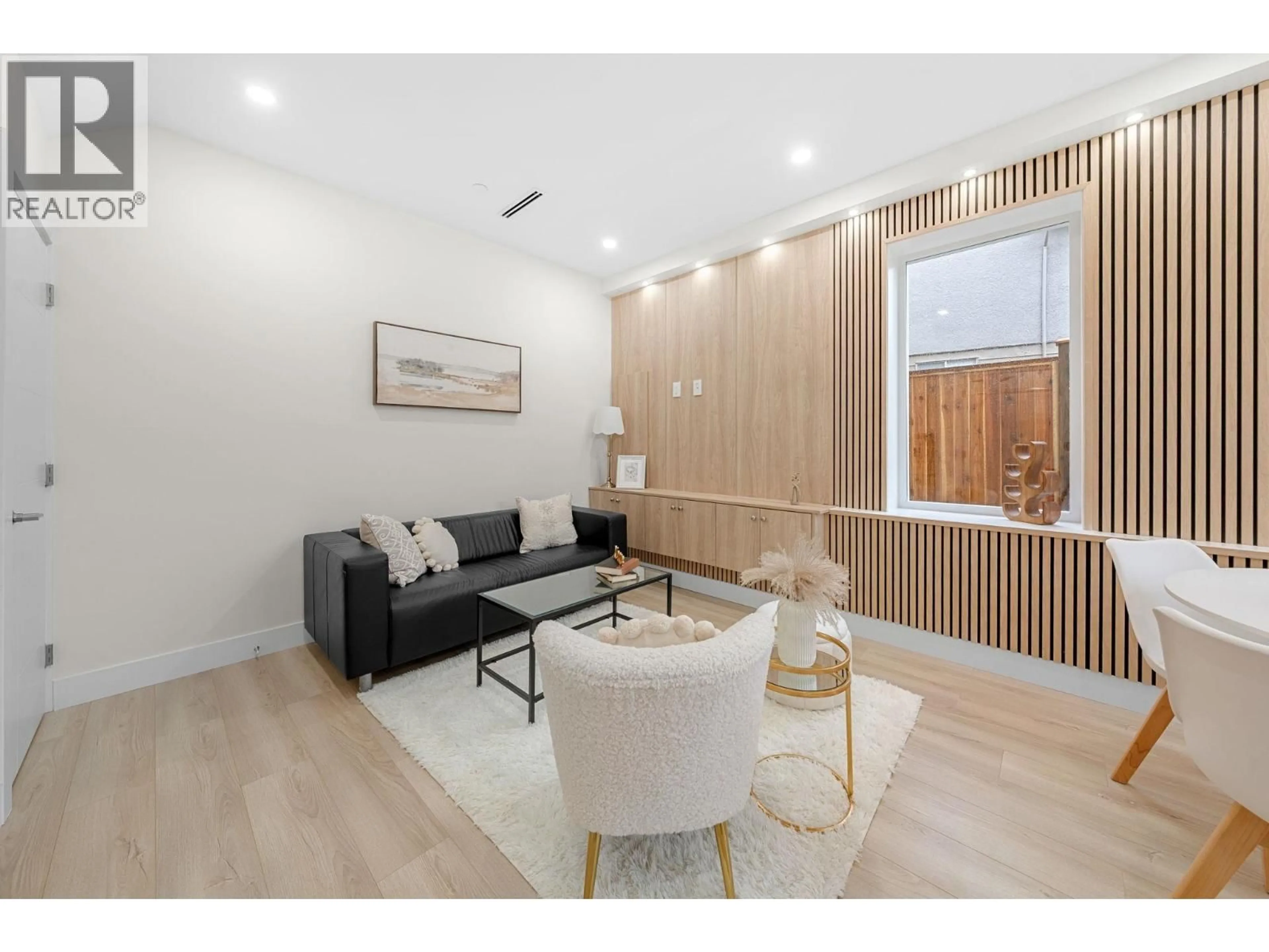 Living room with furniture, wood/laminate floor for 4 - 3581 HAIDA DRIVE, Vancouver British Columbia V5M3Y9