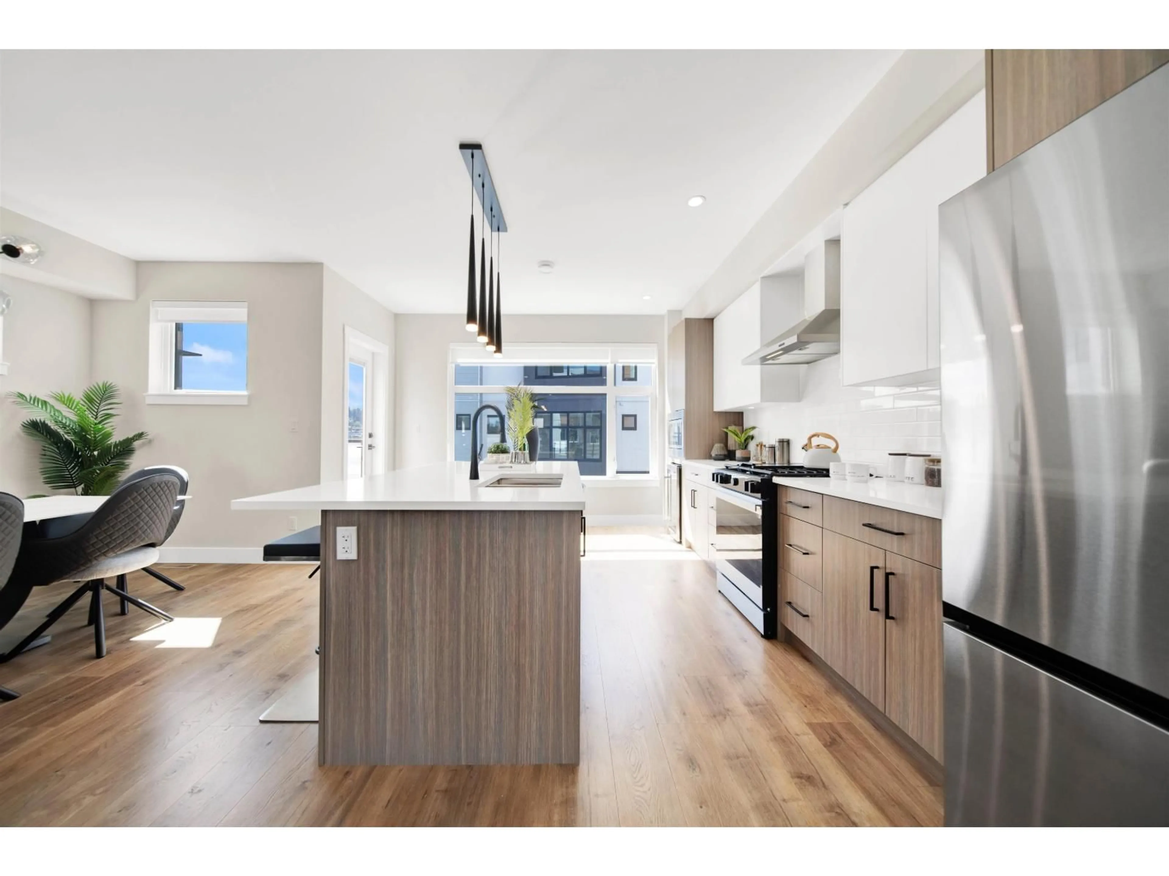 Open concept kitchen, wood/laminate floor for 2 - 177 175A STREET, Surrey British Columbia V3Z1L1