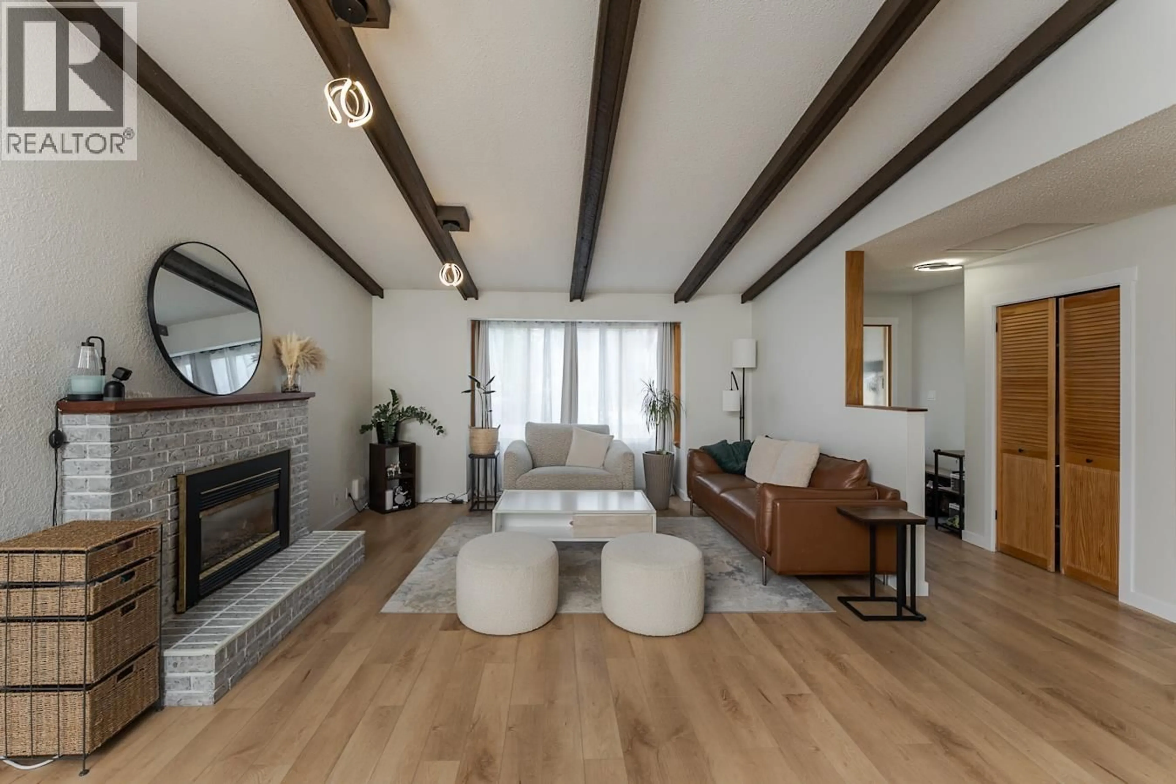Living room with furniture, wood/laminate floor for 1575 BUCHANAN AVENUE, Prince George British Columbia V2L4X8