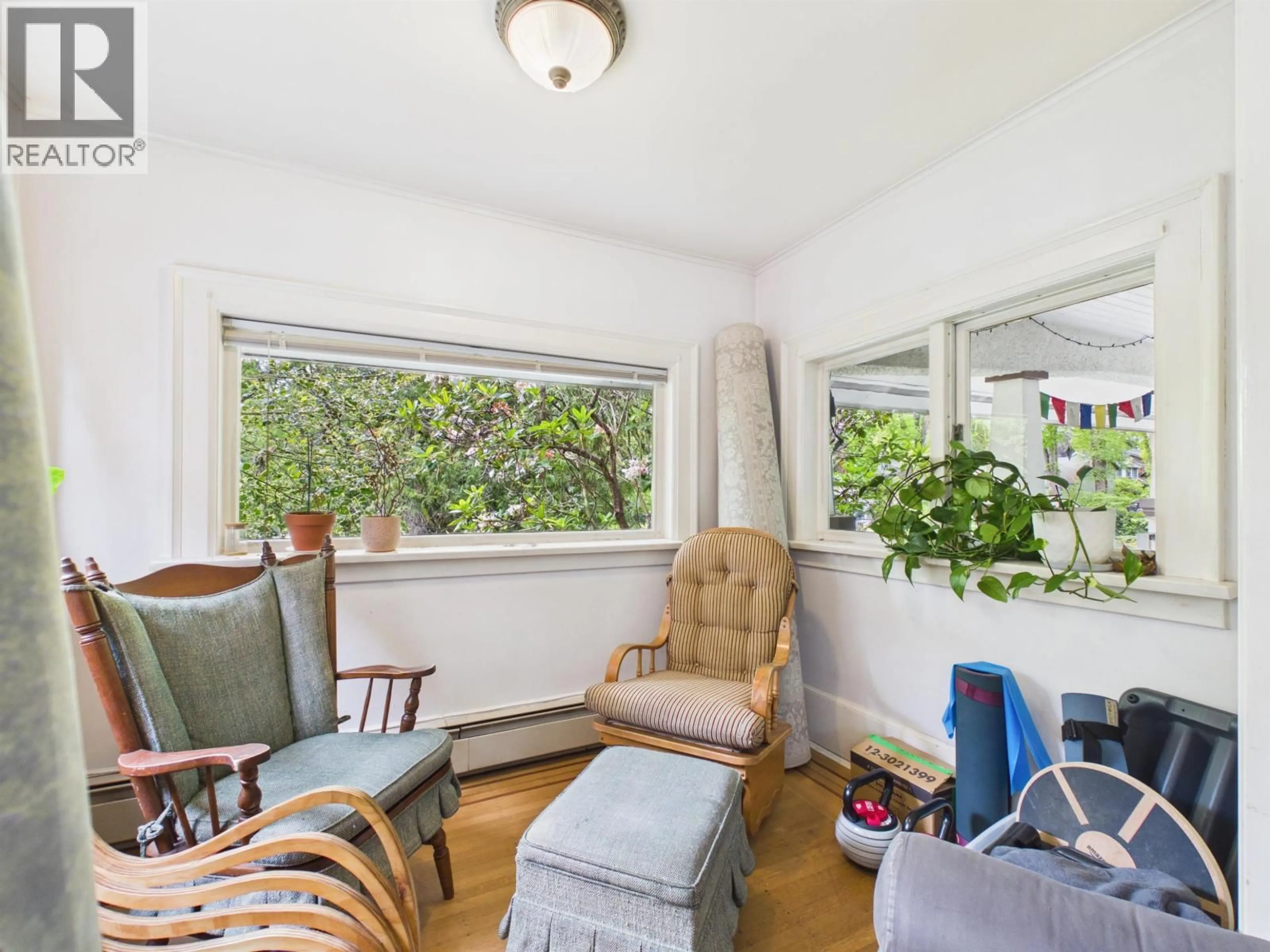 Living room with furniture, wood/laminate floor for 4370 OSLER STREET, Vancouver British Columbia V6H2X7