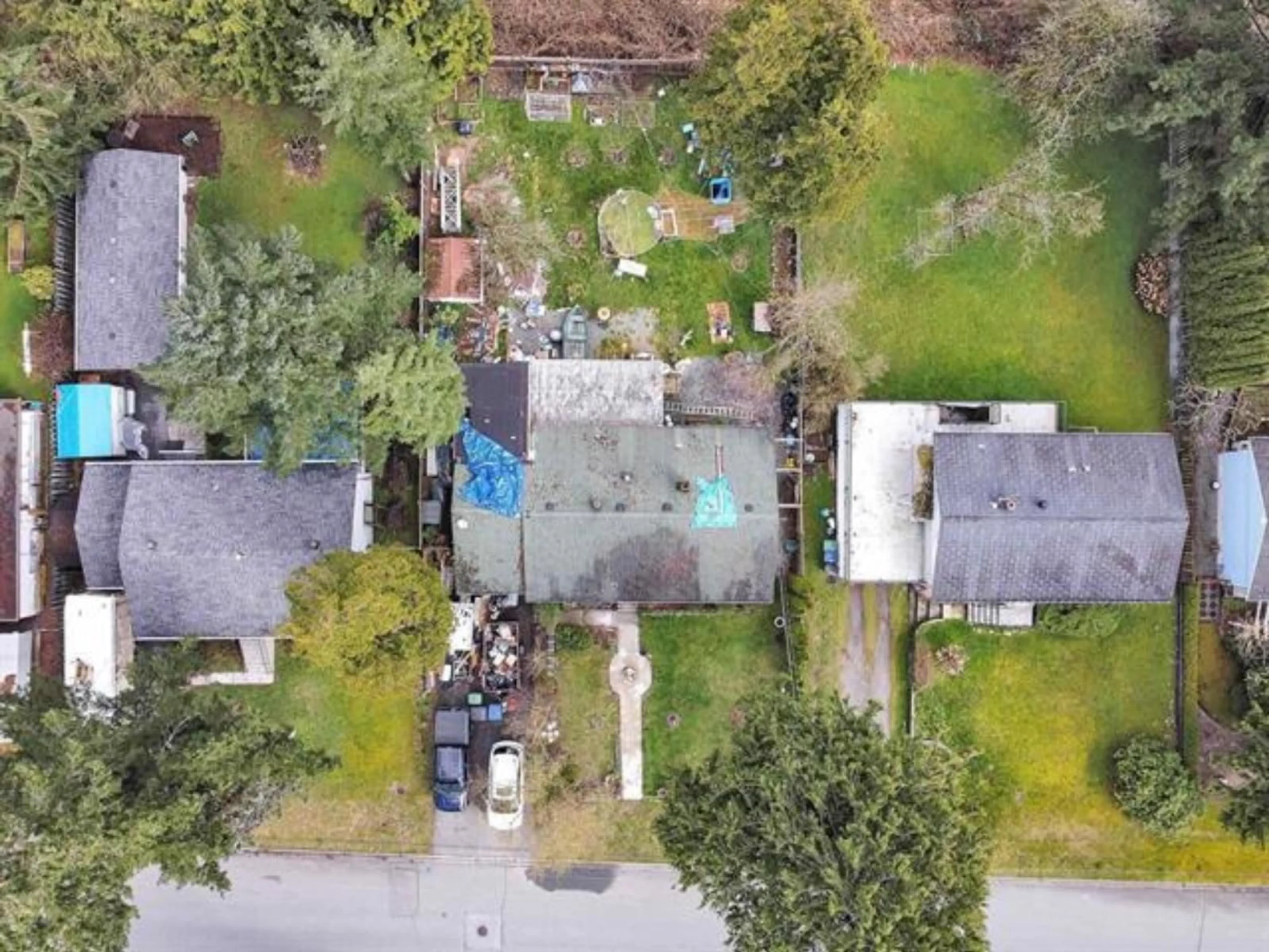 A pic from outside/outdoor area/front of a property/back of a property/a pic from drone, street for 10464 154A STREET, Surrey British Columbia V3R4K1