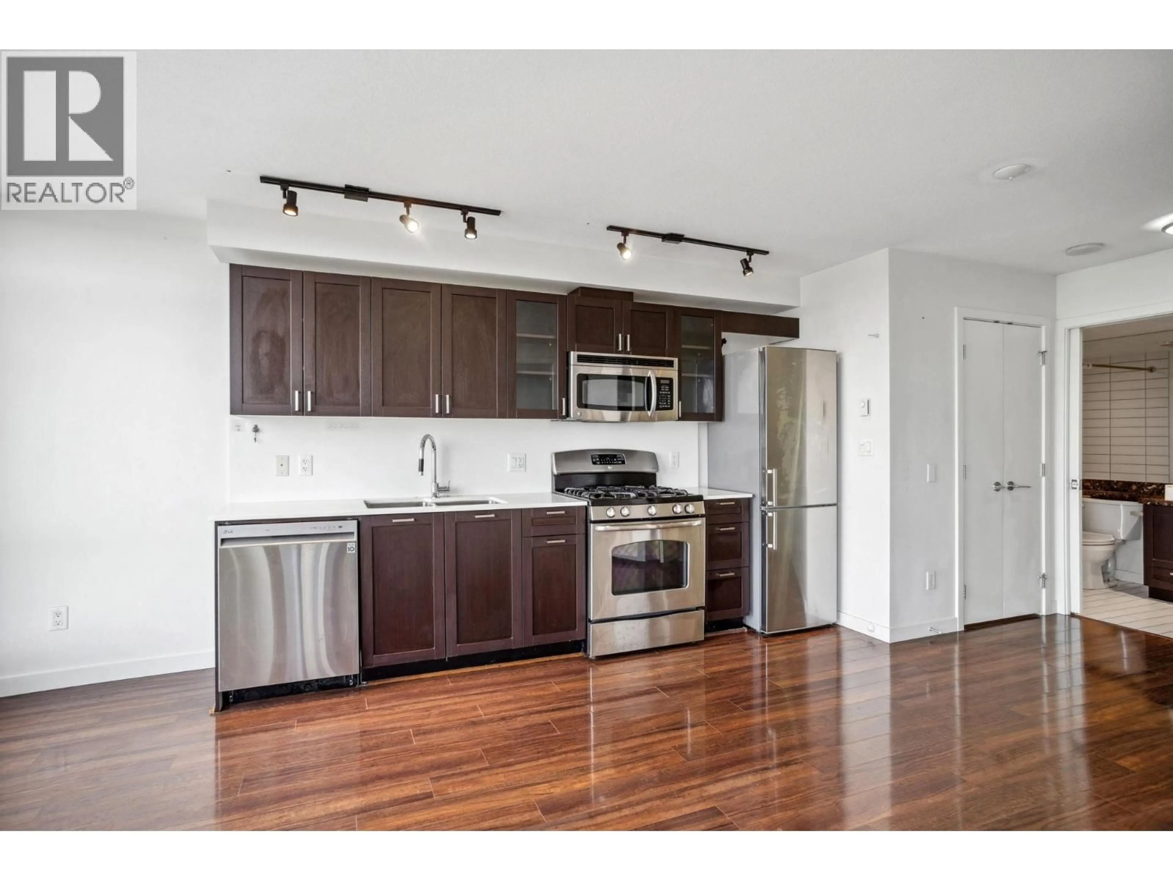 Open concept kitchen, wood/laminate floor for 810 - 4815 ELDORADO MEWS, Vancouver British Columbia V5R0B2
