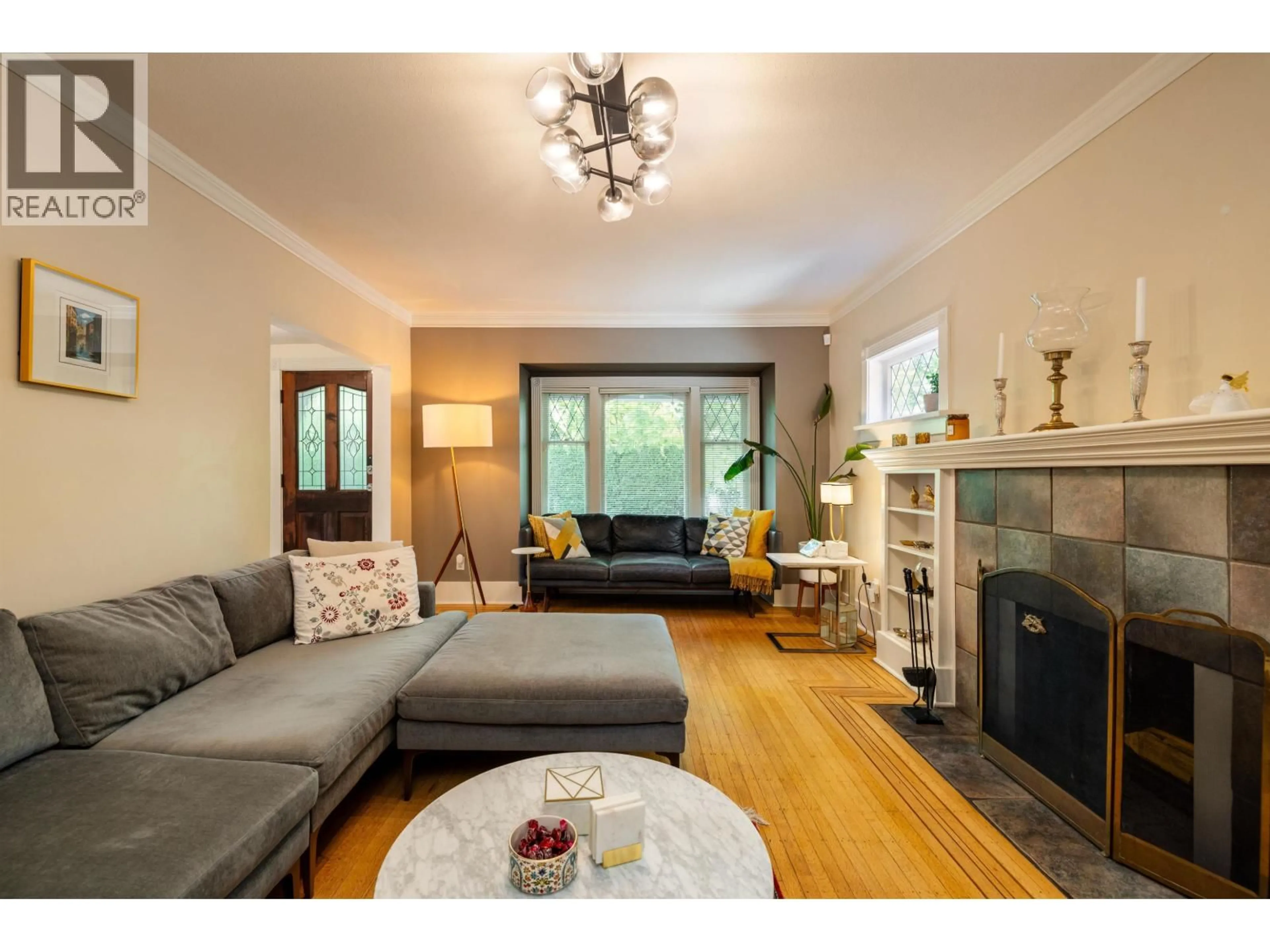 Living room with furniture, wood/laminate floor for 4343 11TH AVENUE, Vancouver British Columbia V6R2L9