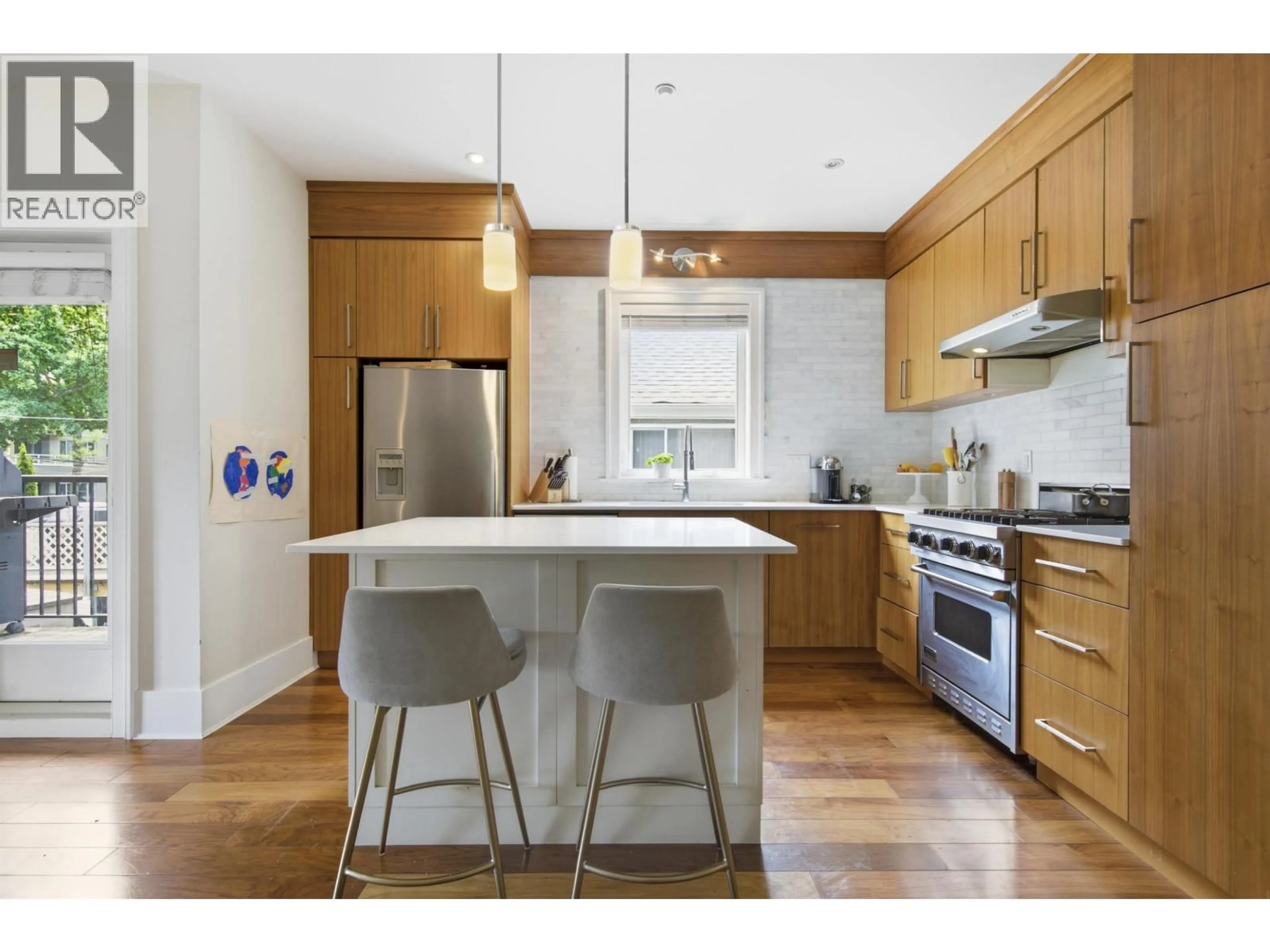 Open concept kitchen, wood/laminate floor for 2436 8TH AVENUE, Vancouver British Columbia V6K2B1