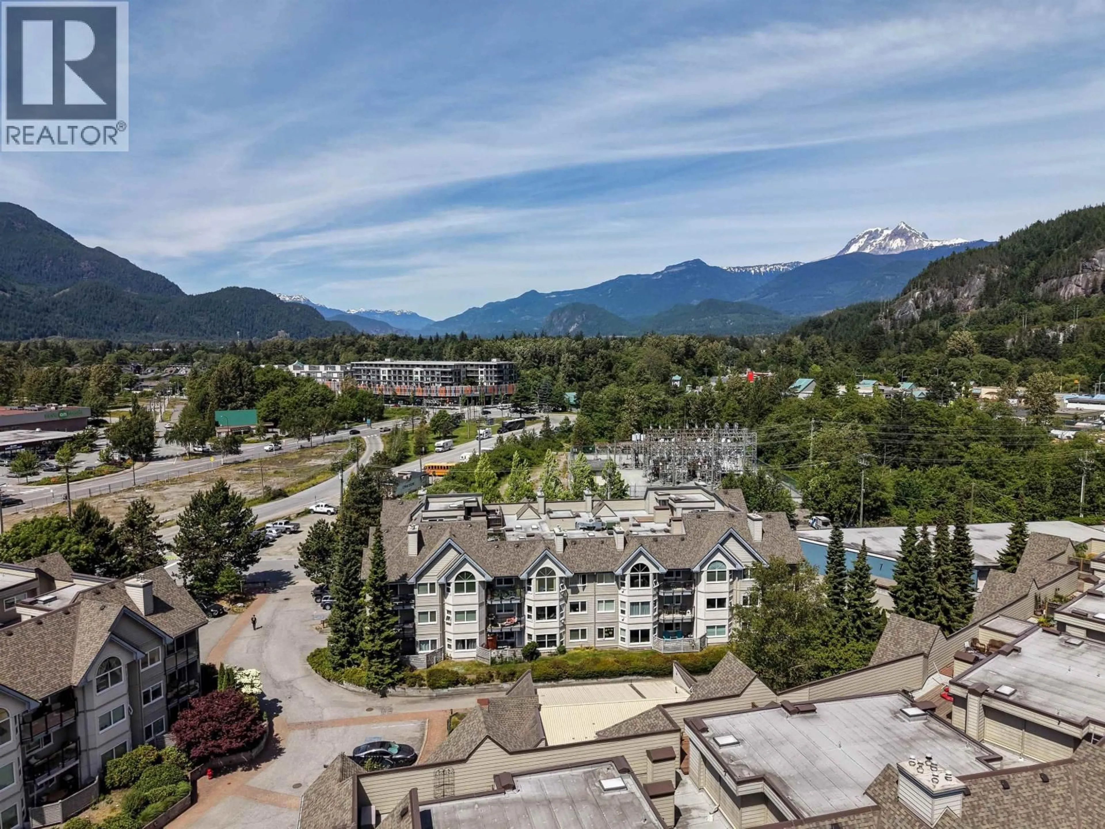 A pic from outside/outdoor area/front of a property/back of a property/a pic from drone, mountain view for 201 - 1460 PEMBERTON AVENUE, Squamish British Columbia V8B0J9