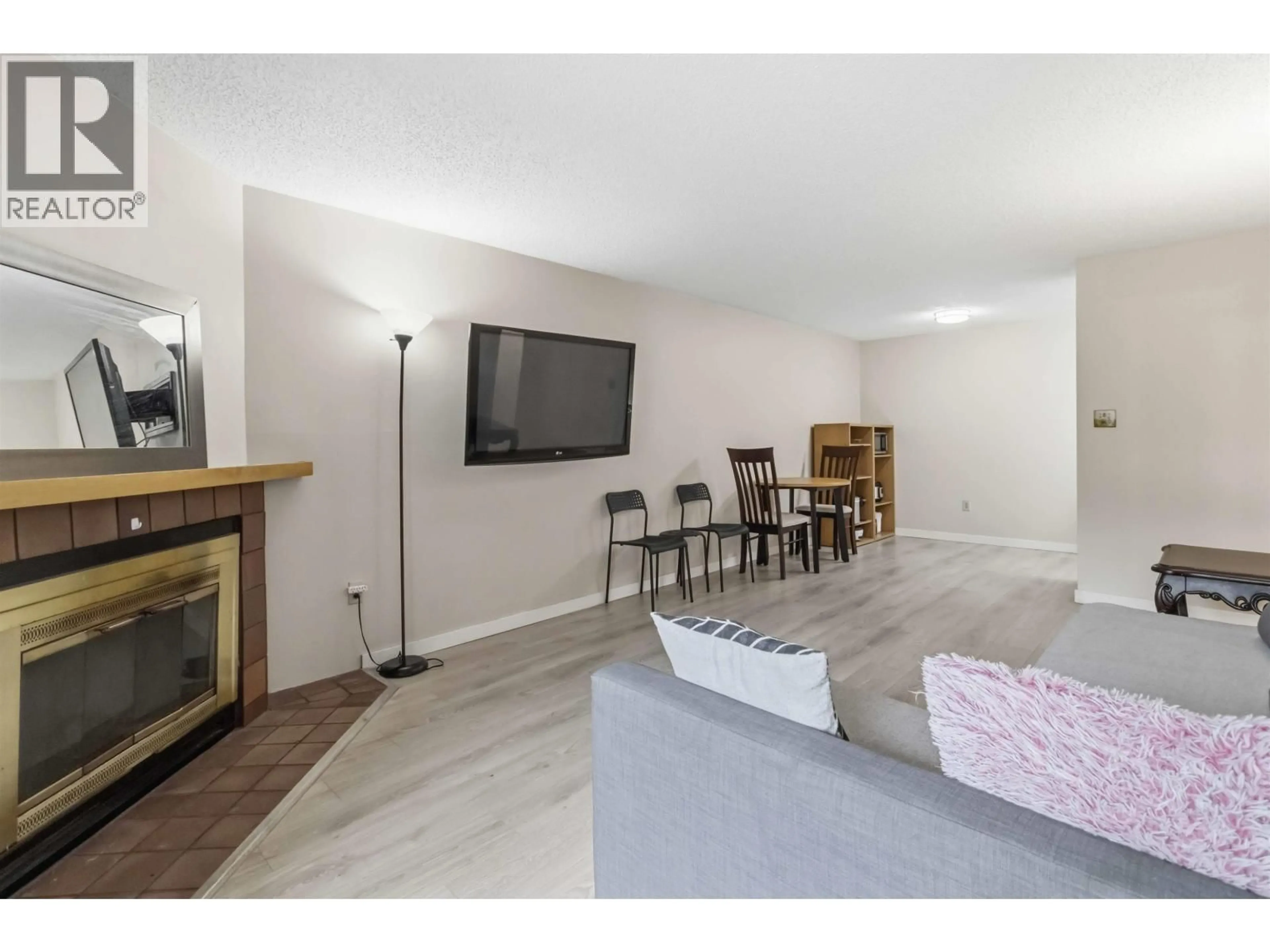 Living room with furniture, wood/laminate floor for 126 - 7295 MOFFATT ROAD, Richmond British Columbia V6Y3E5