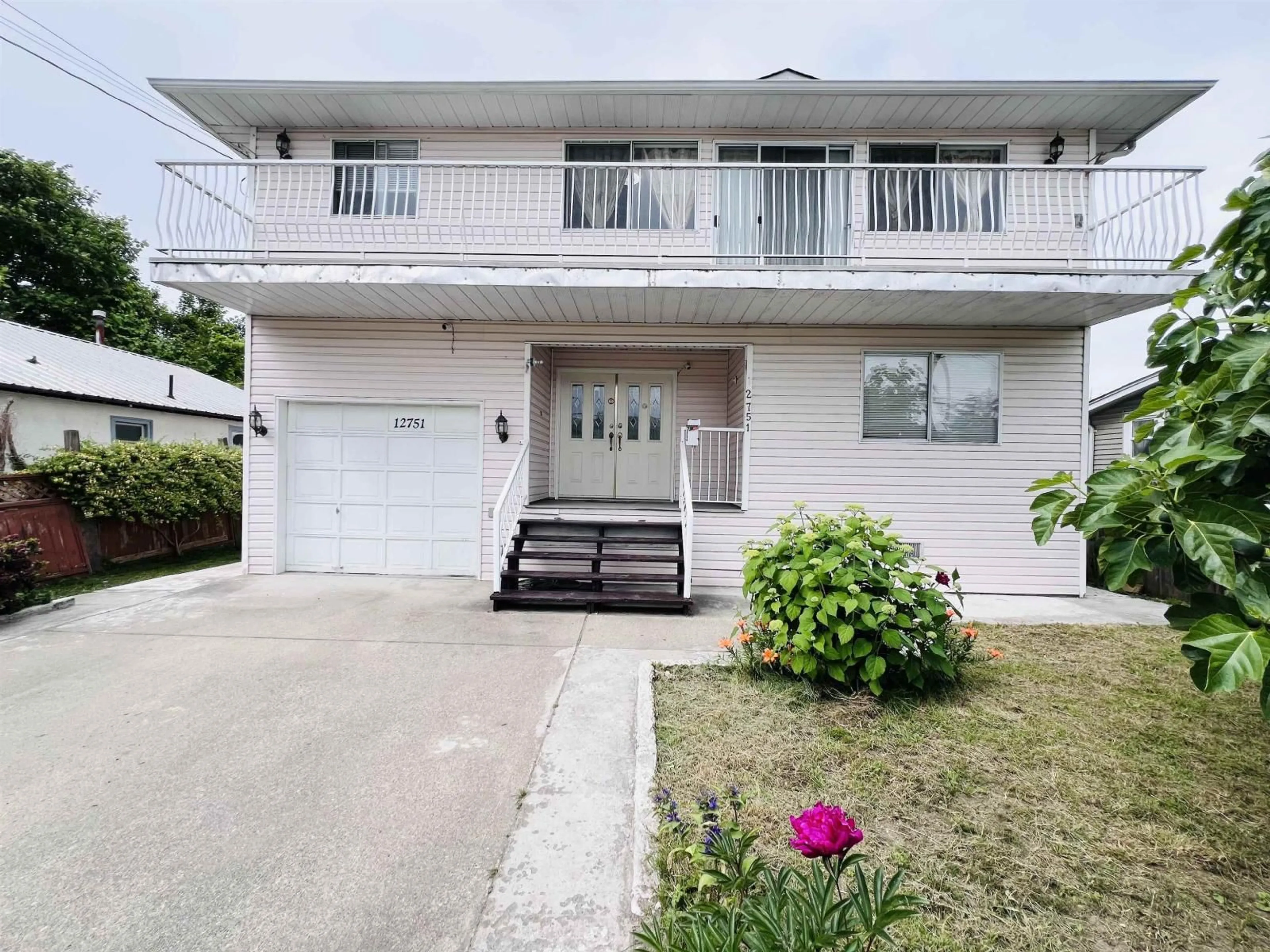 Home with vinyl exterior material, street for 12751 115A AVENUE, Surrey British Columbia V3V3R3