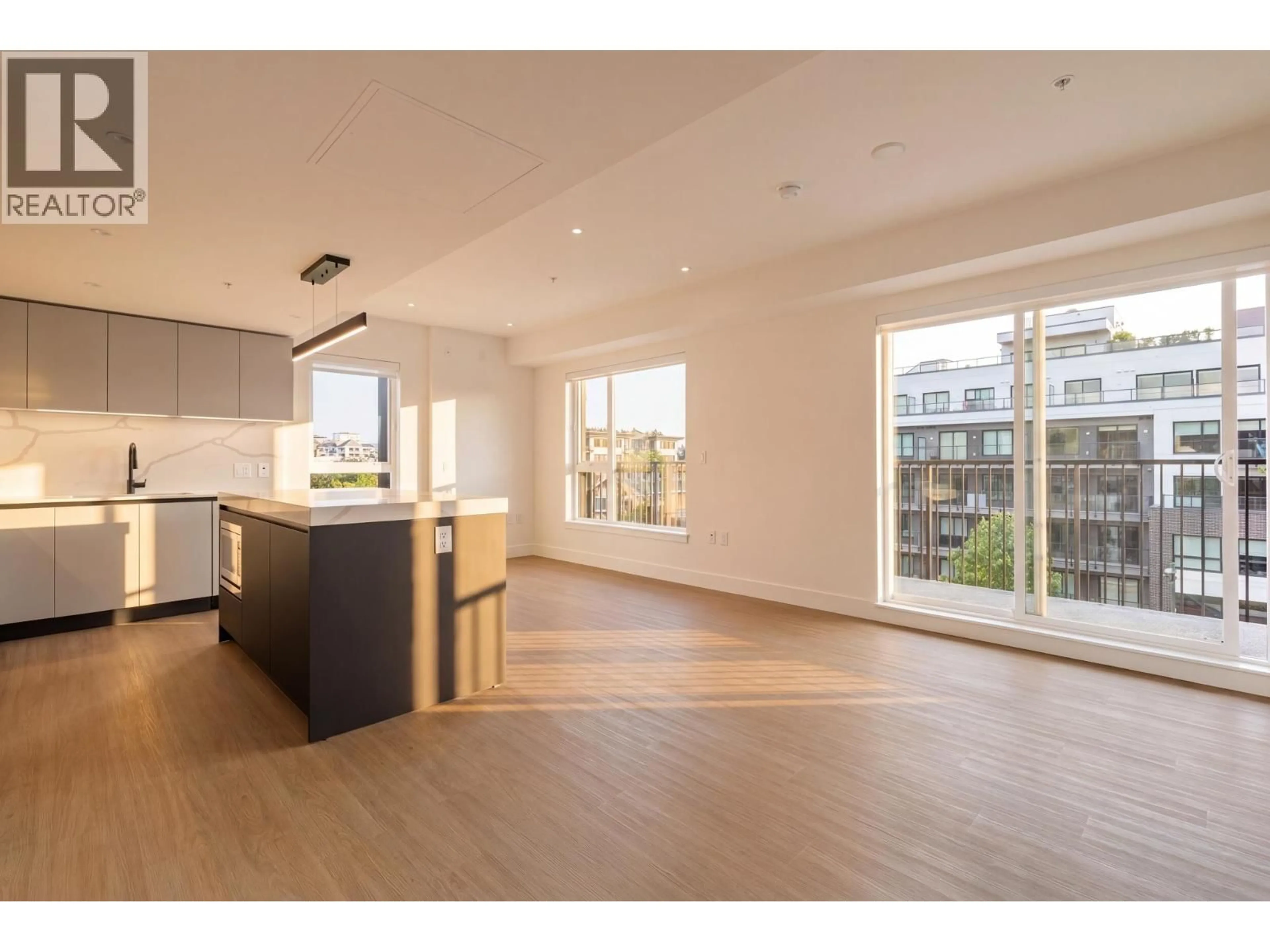 Open concept kitchen, wood/laminate floor for 503 - 2235 BROADWAY, Vancouver British Columbia V5N0J5