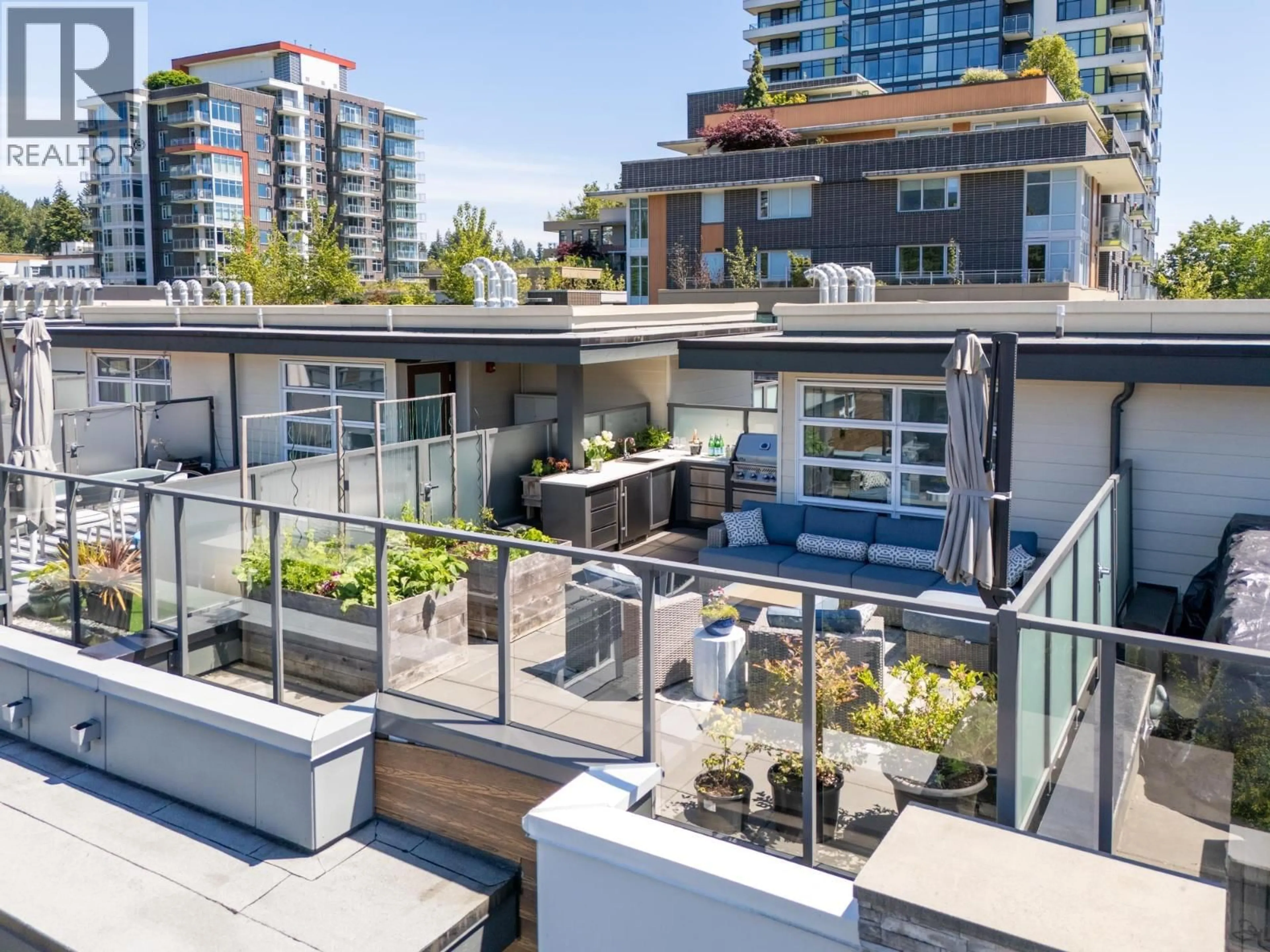Patio, city buildings view from balcony for 215 - 2060 CURLING ROAD, North Vancouver British Columbia V7P0E1