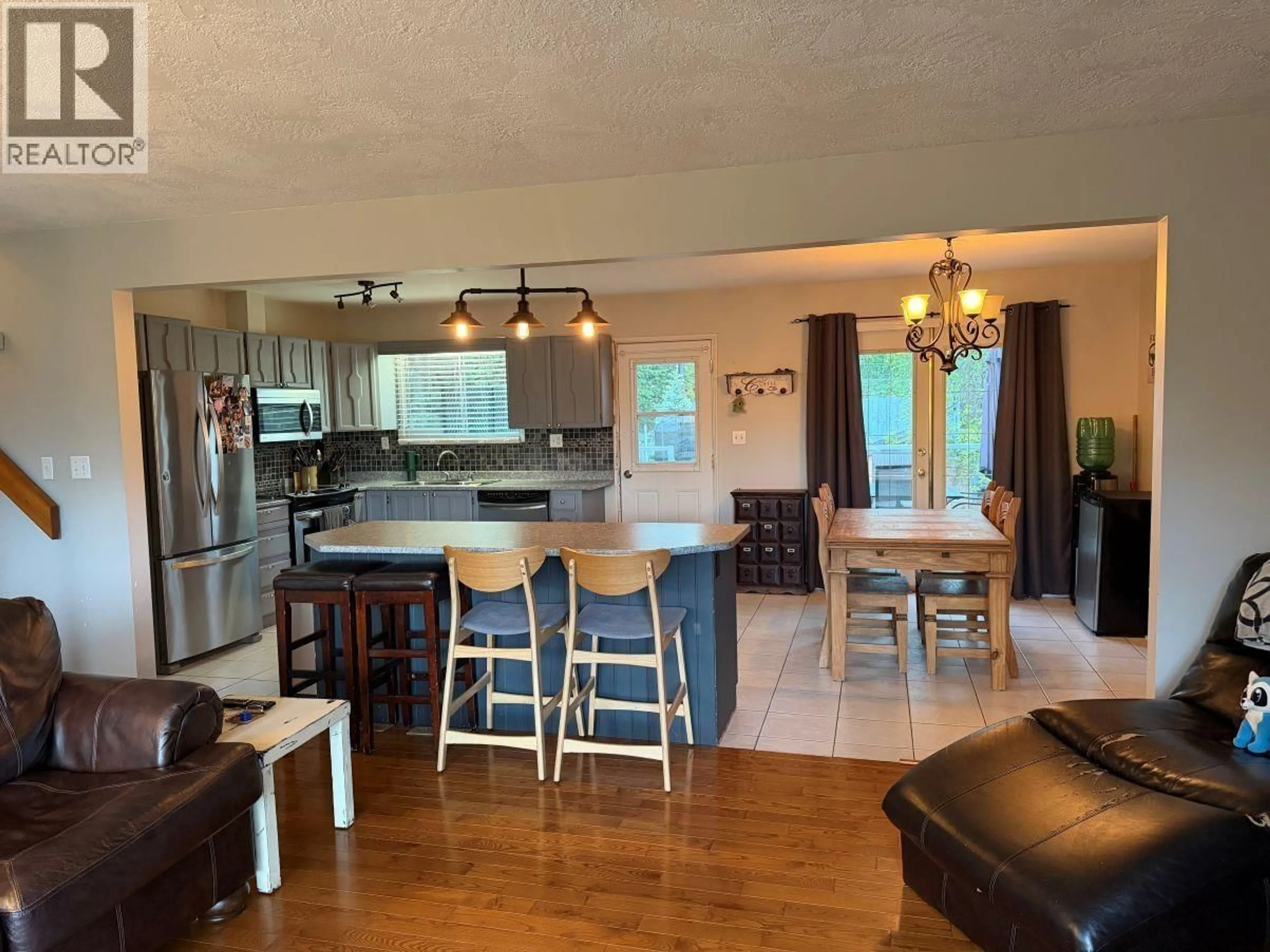 Open concept kitchen, wood/laminate floor for 9141 VIKING ROAD, Prince George British Columbia V2K5T7