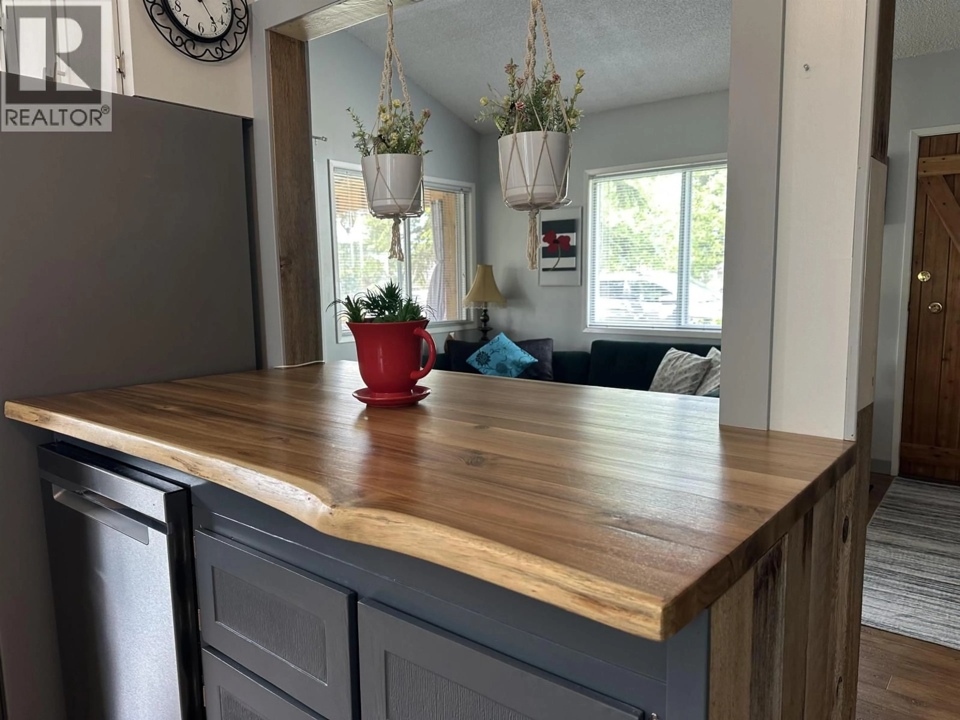 Open concept kitchen, wood/laminate floor for 6445 LIVINGSTON ROAD, 70 Mile House British Columbia V0K2K1