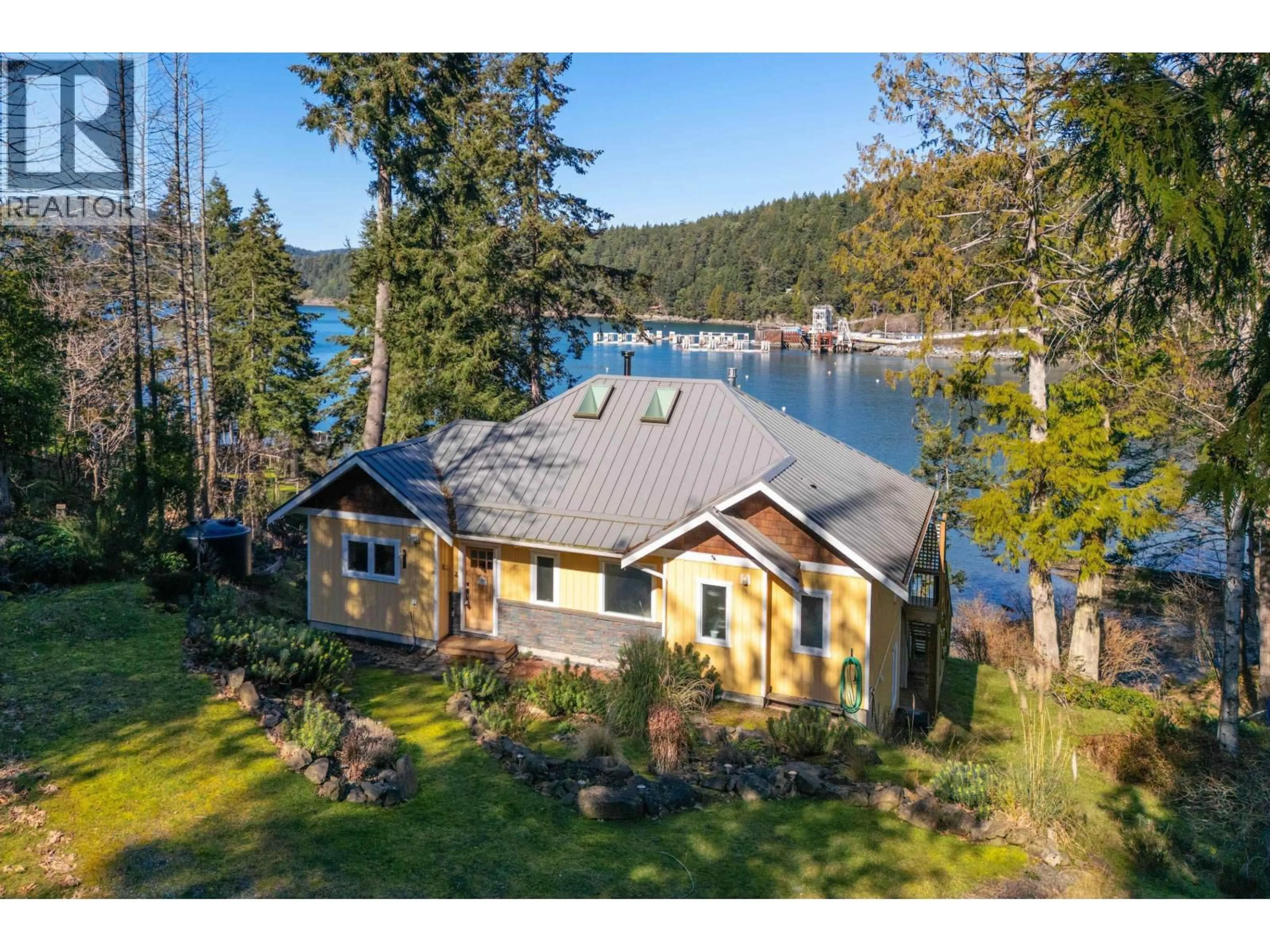 A pic from outside/outdoor area/front of a property/back of a property/a pic from drone, water/lake/river/ocean view for 225 MARINERS WAY, Mayne Island British Columbia V0N2J2