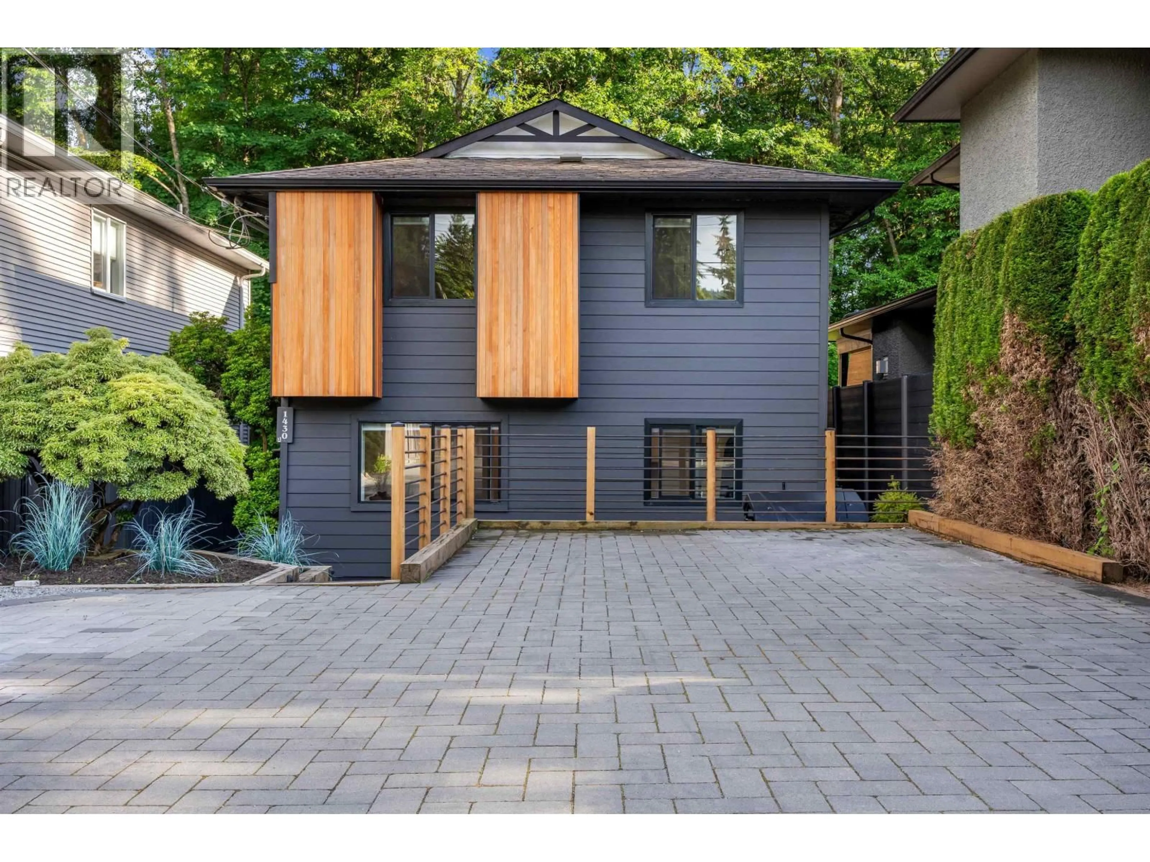 Home with brick exterior material, street for 1430 DRAYCOTT ROAD, North Vancouver British Columbia V7J1W2