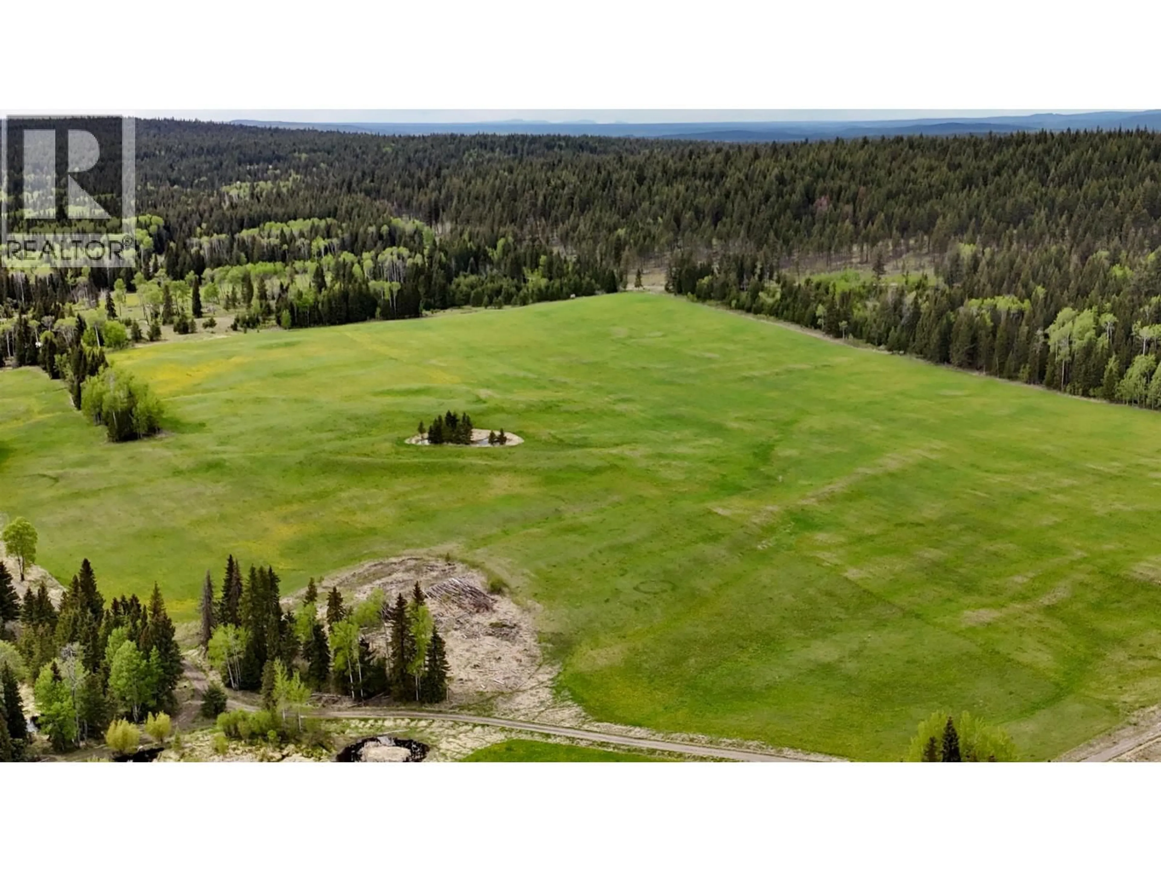A pic from outside/outdoor area/front of a property/back of a property/a pic from drone, forest/trees view for 6310 HORSE LAKE ROAD, 100 Mile House British Columbia V0K2E3