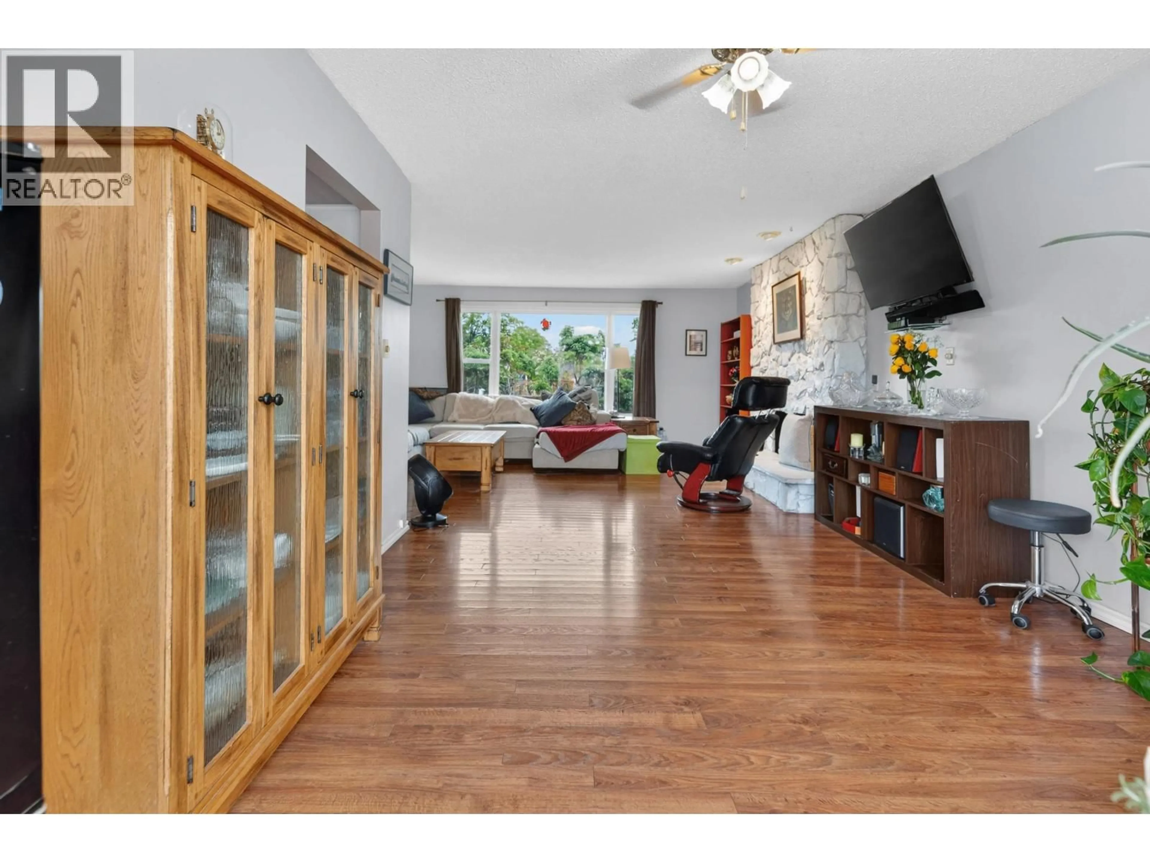 Living room with furniture, wood/laminate floor for 4293 PUNCHAW CRESCENT, Prince George British Columbia V2M5G1
