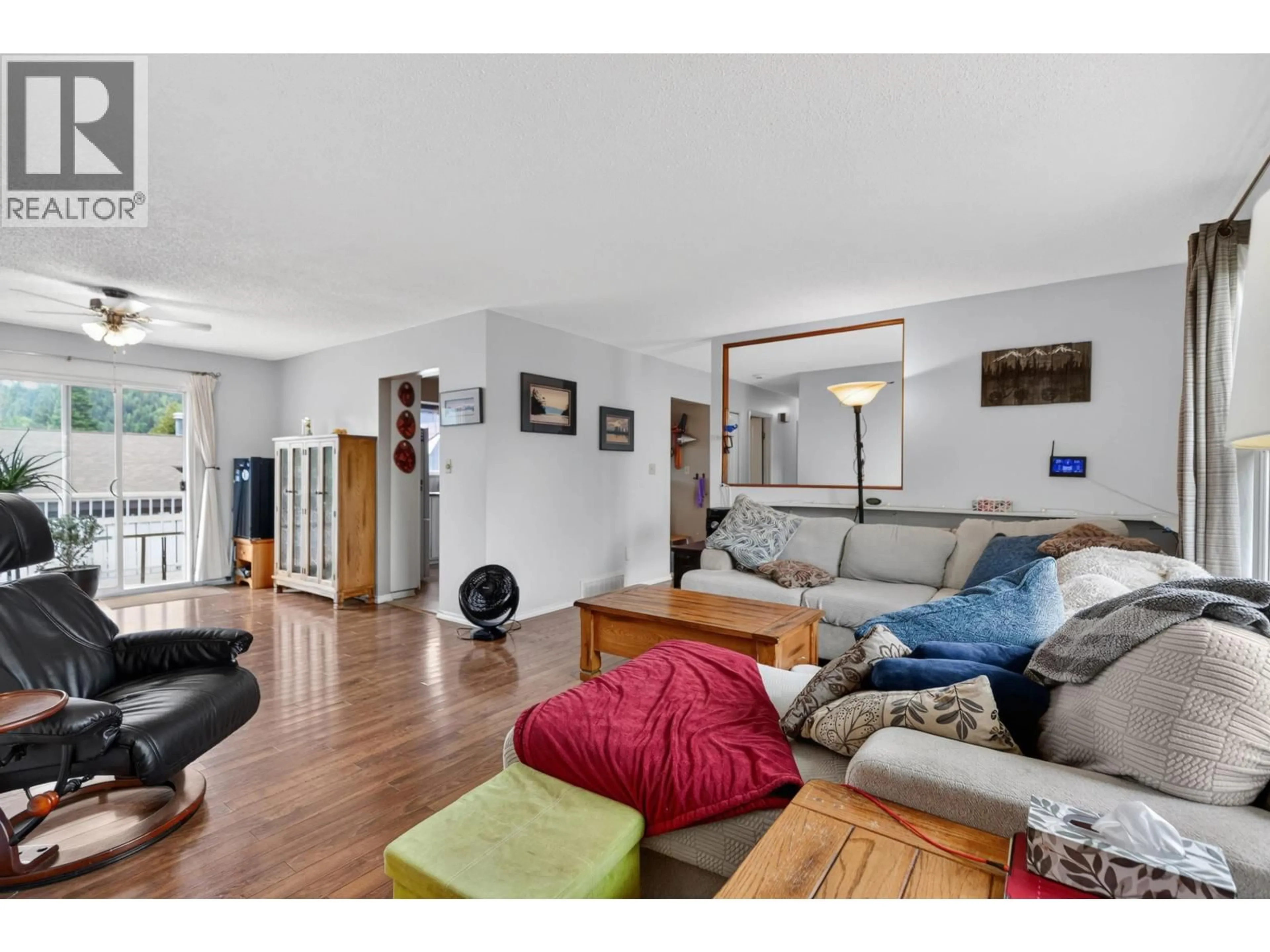 Living room with furniture, wood/laminate floor for 4293 PUNCHAW CRESCENT, Prince George British Columbia V2M5G1