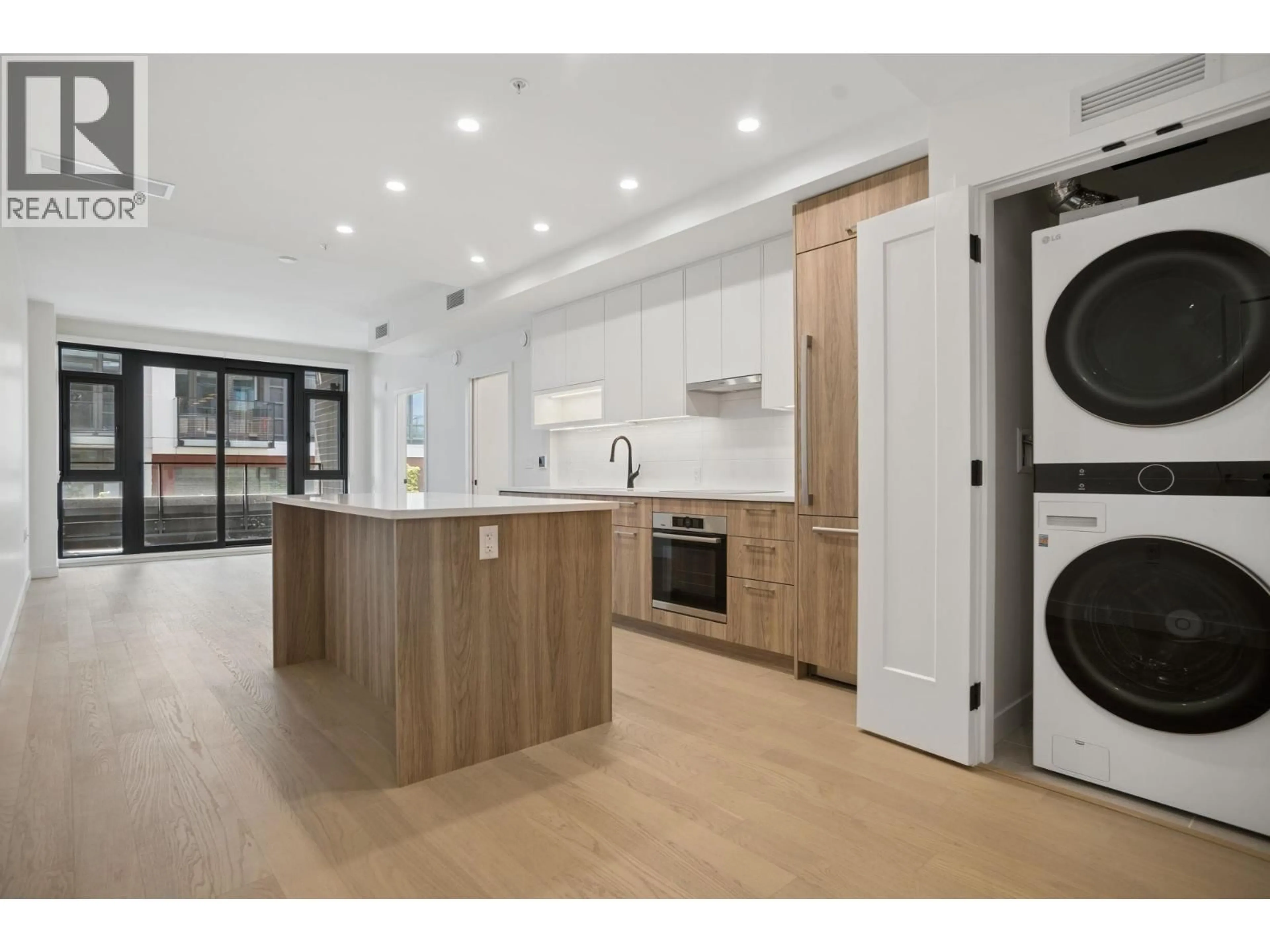 Open concept kitchen, wood/laminate floor for 204 - 8398 OAK STREET, Vancouver British Columbia V6P0L9