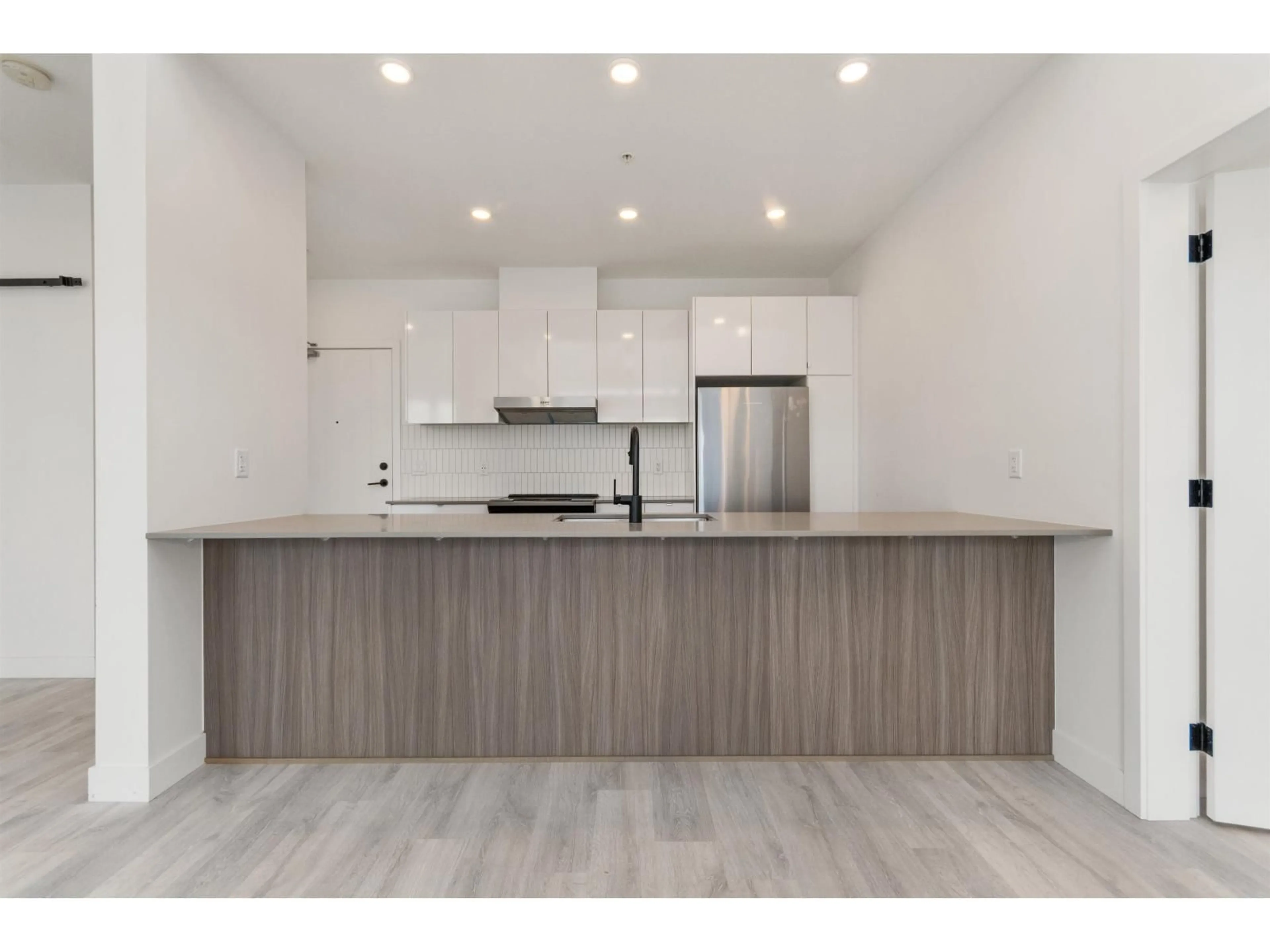 Open concept kitchen, wood/laminate floor for 604 - 32838 LANDEAU PLACE, Abbotsford British Columbia V2S0M6
