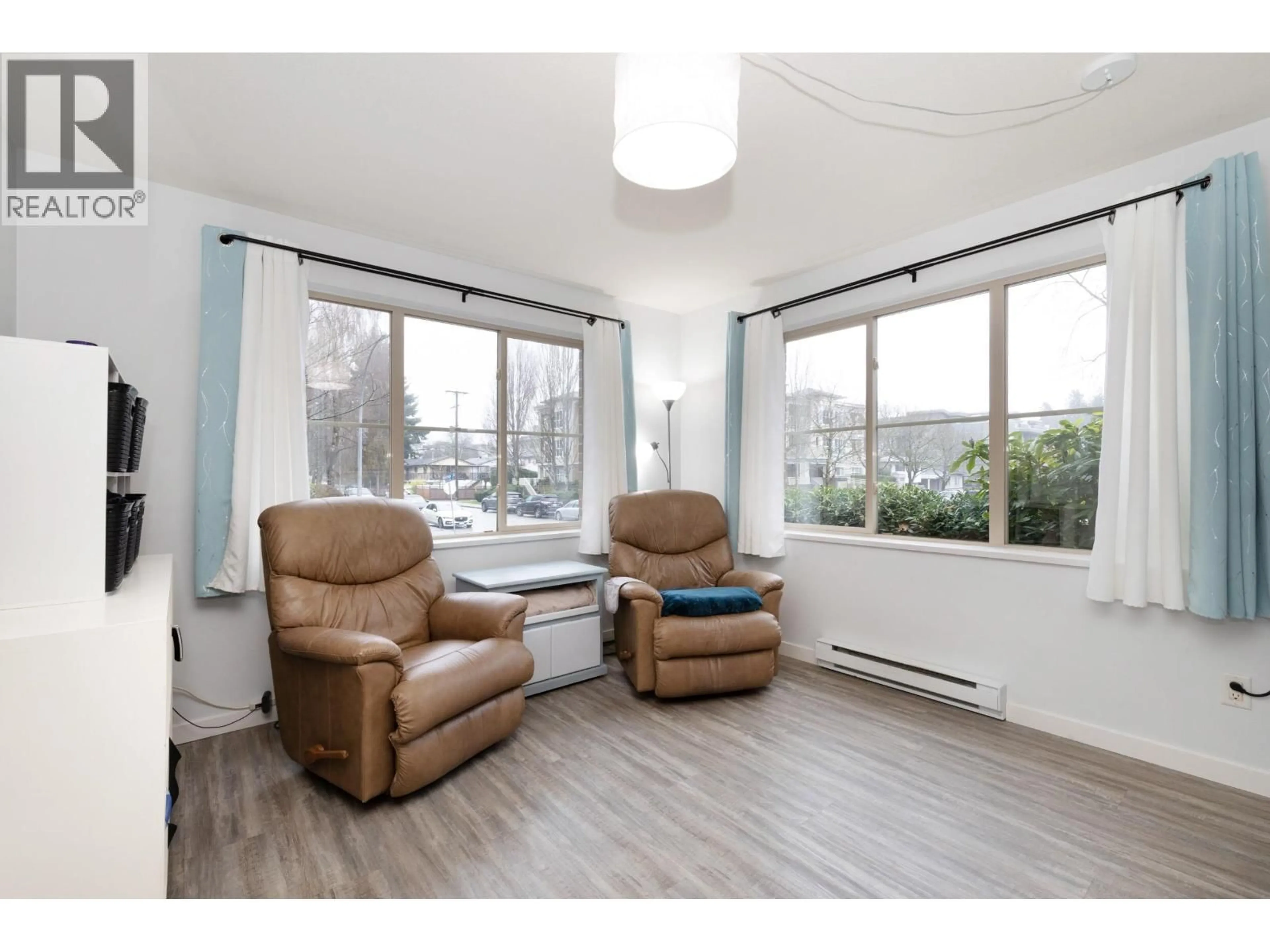 Living room with furniture, wood/laminate floor for 105 - 2432 WELCHER AVENUE, Port Coquitlam British Columbia V3C1X7