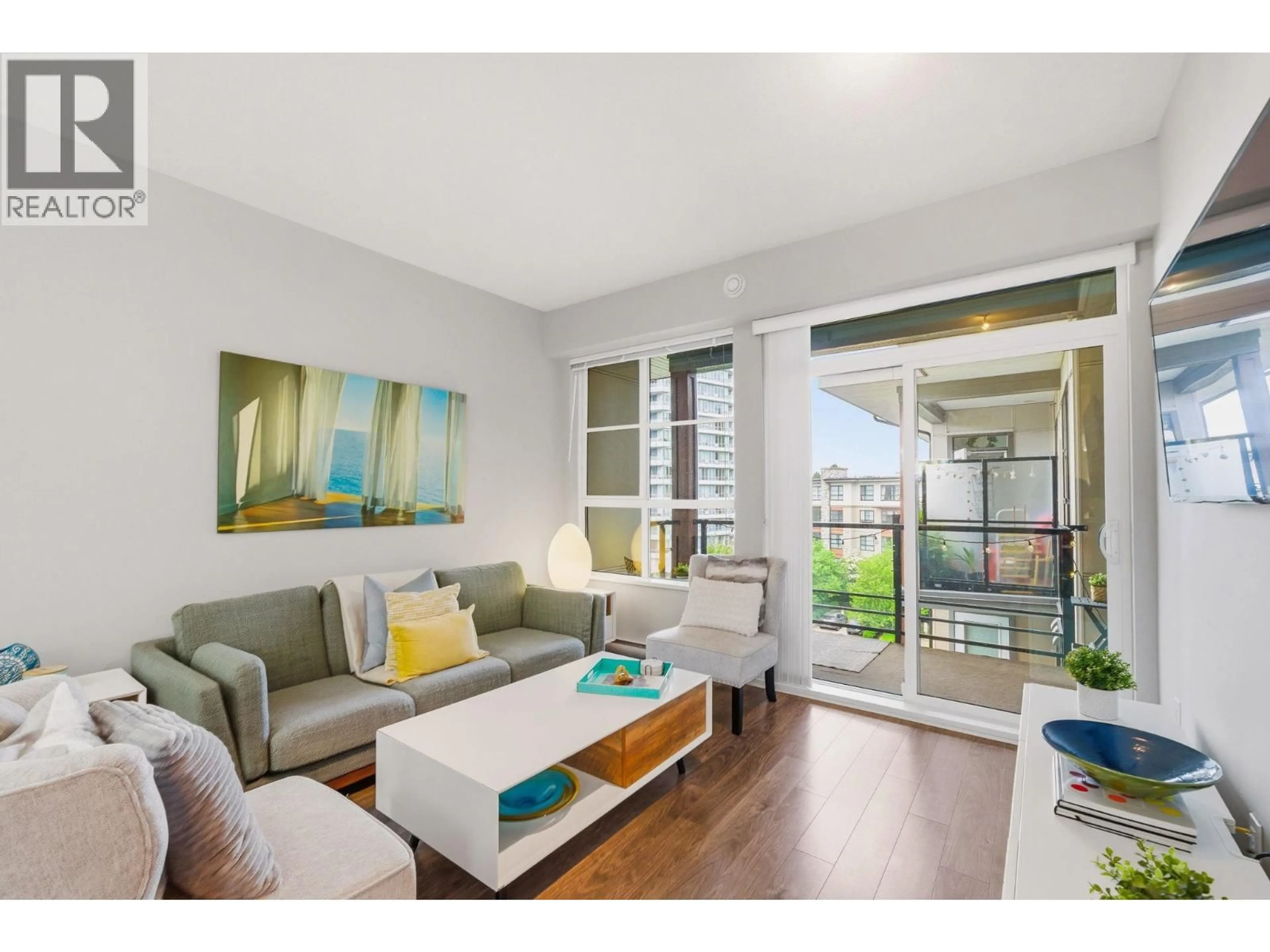 Living room with furniture, wood/laminate floor for 512 - 1152 WINDSOR MEWS, Coquitlam British Columbia V3B0N1