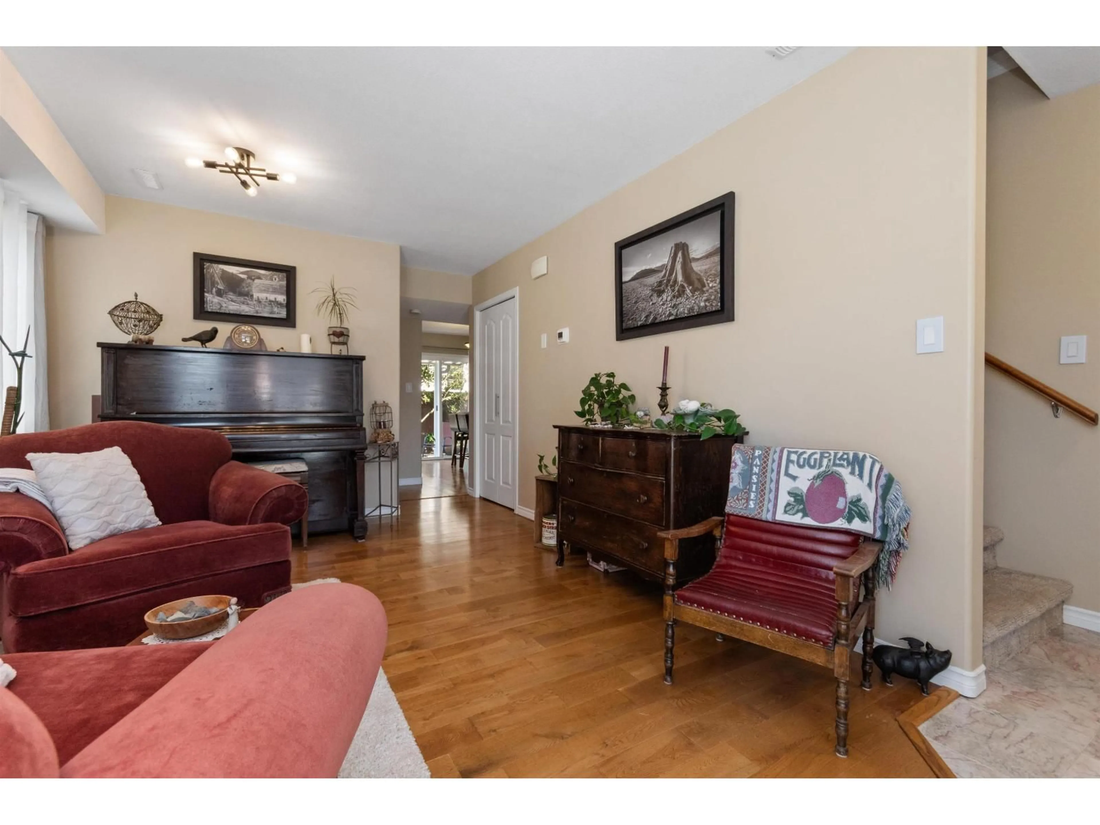Living room with furniture, wood/laminate floor for 12 - 9486 WOODBINE STREET, Chilliwack British Columbia V2P5S4