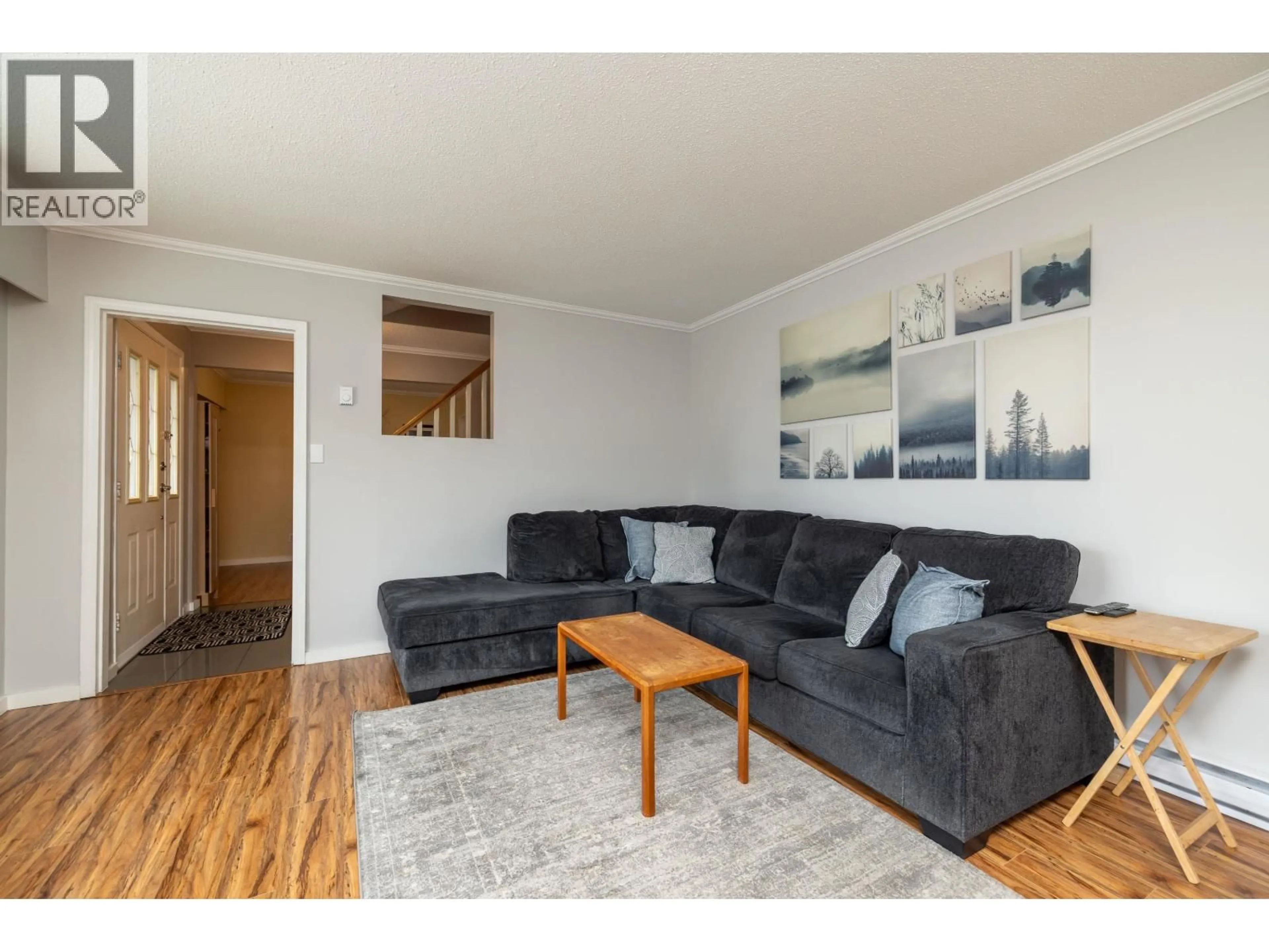 Living room with furniture, wood/laminate floor for 5567 44 AVENUE, Delta British Columbia V4K1C9