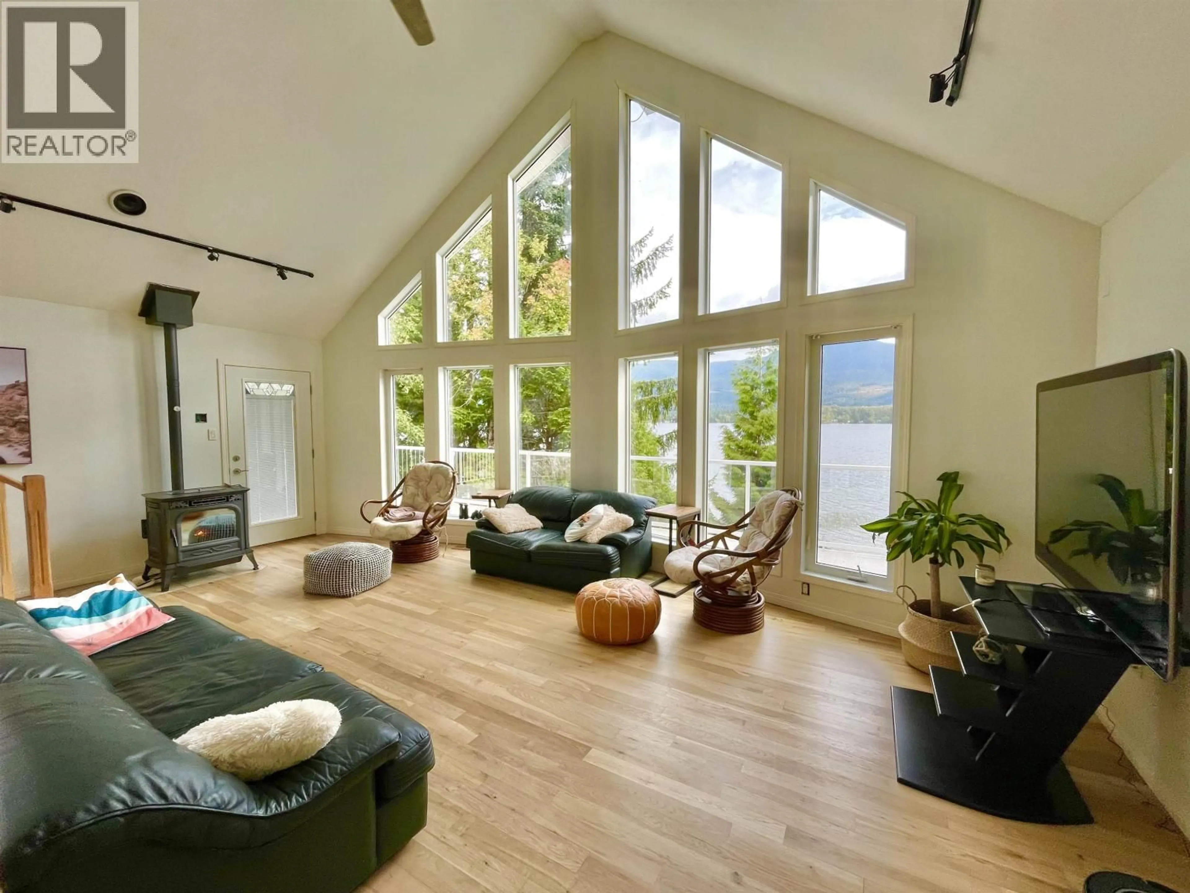 Living room with furniture, wood/laminate floor for 2240 CATT POINT ROAD, Terrace British Columbia V0V0V0