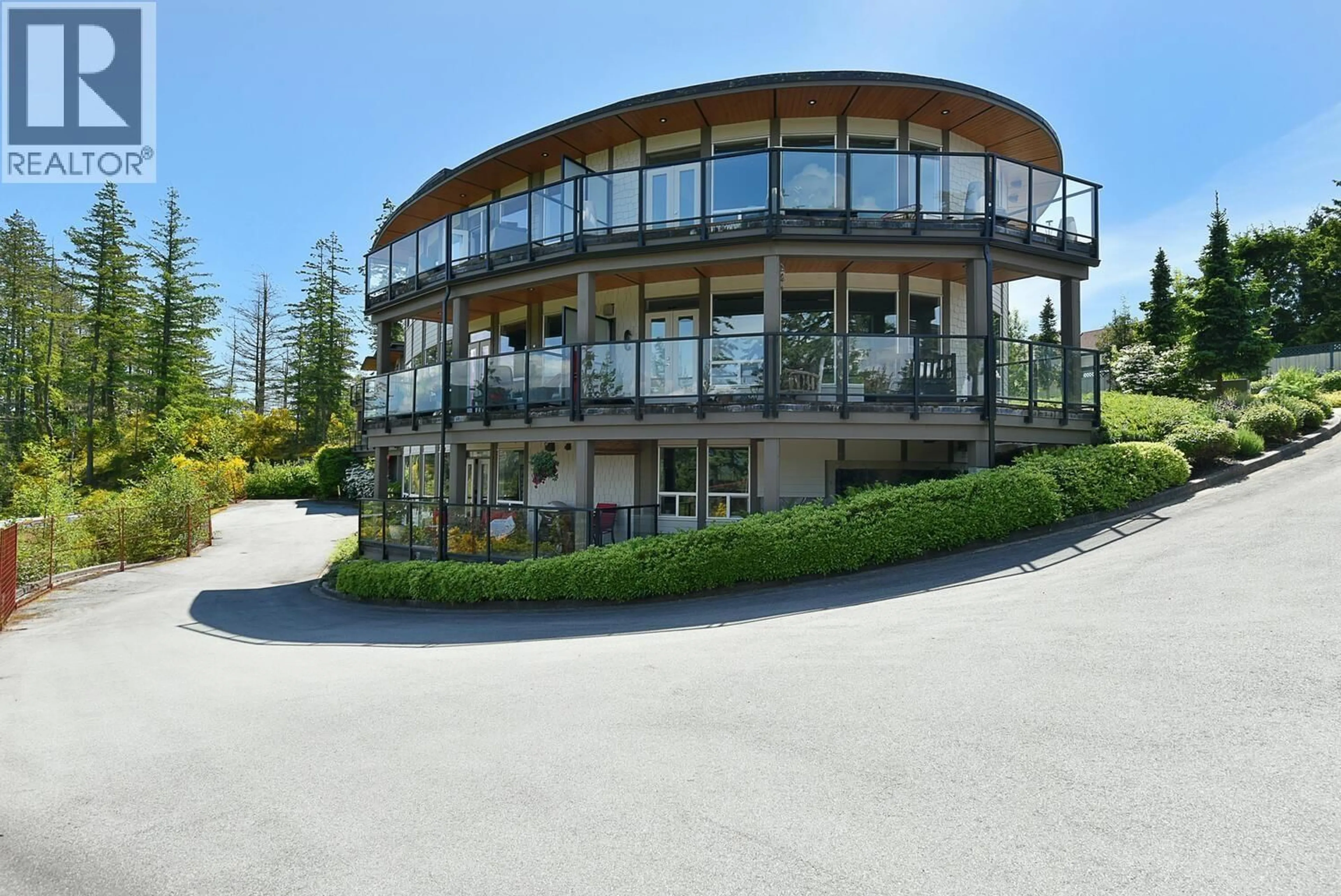 A pic from outside/outdoor area/front of a property/back of a property/a pic from drone, water/lake/river/ocean view for 302 - 5780 MARINE WAY, Sechelt British Columbia V7Z0L8