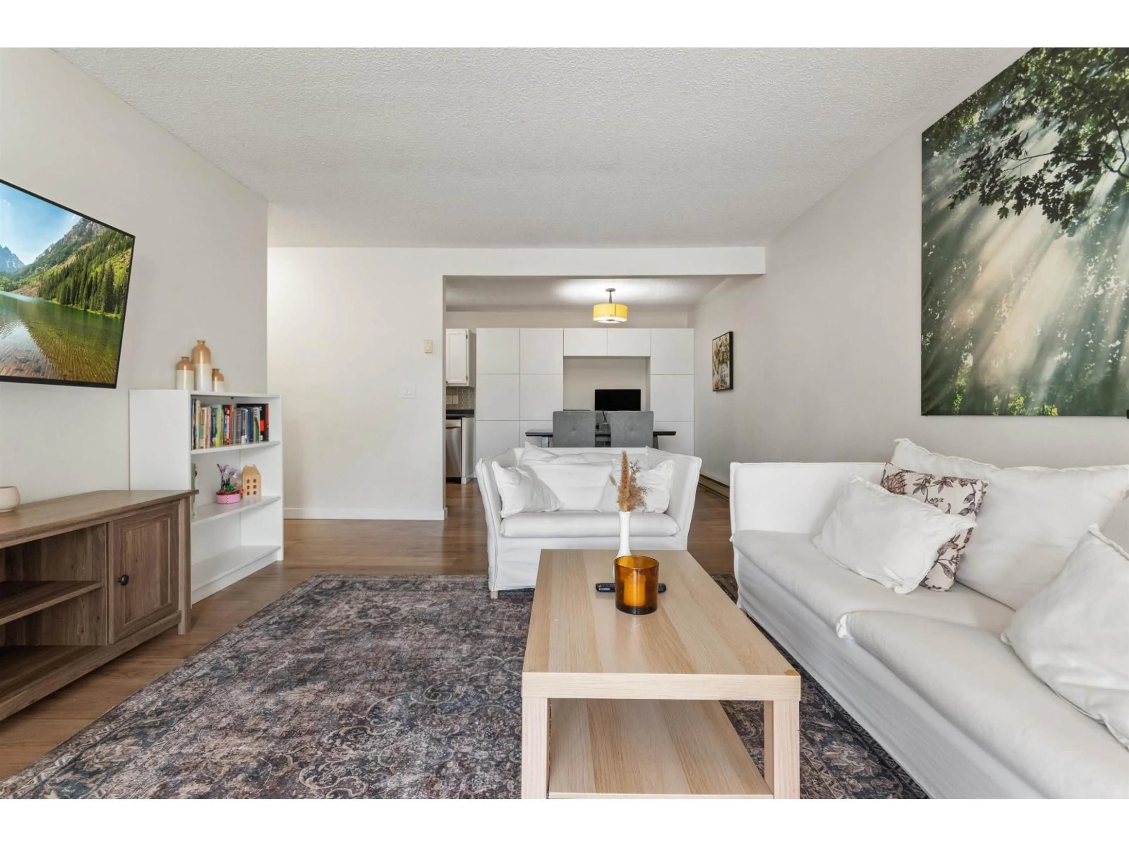 Living room with furniture, wood/laminate floor for 210 - 45900 LEWIS AVENUE, Chilliwack British Columbia V2P3C2