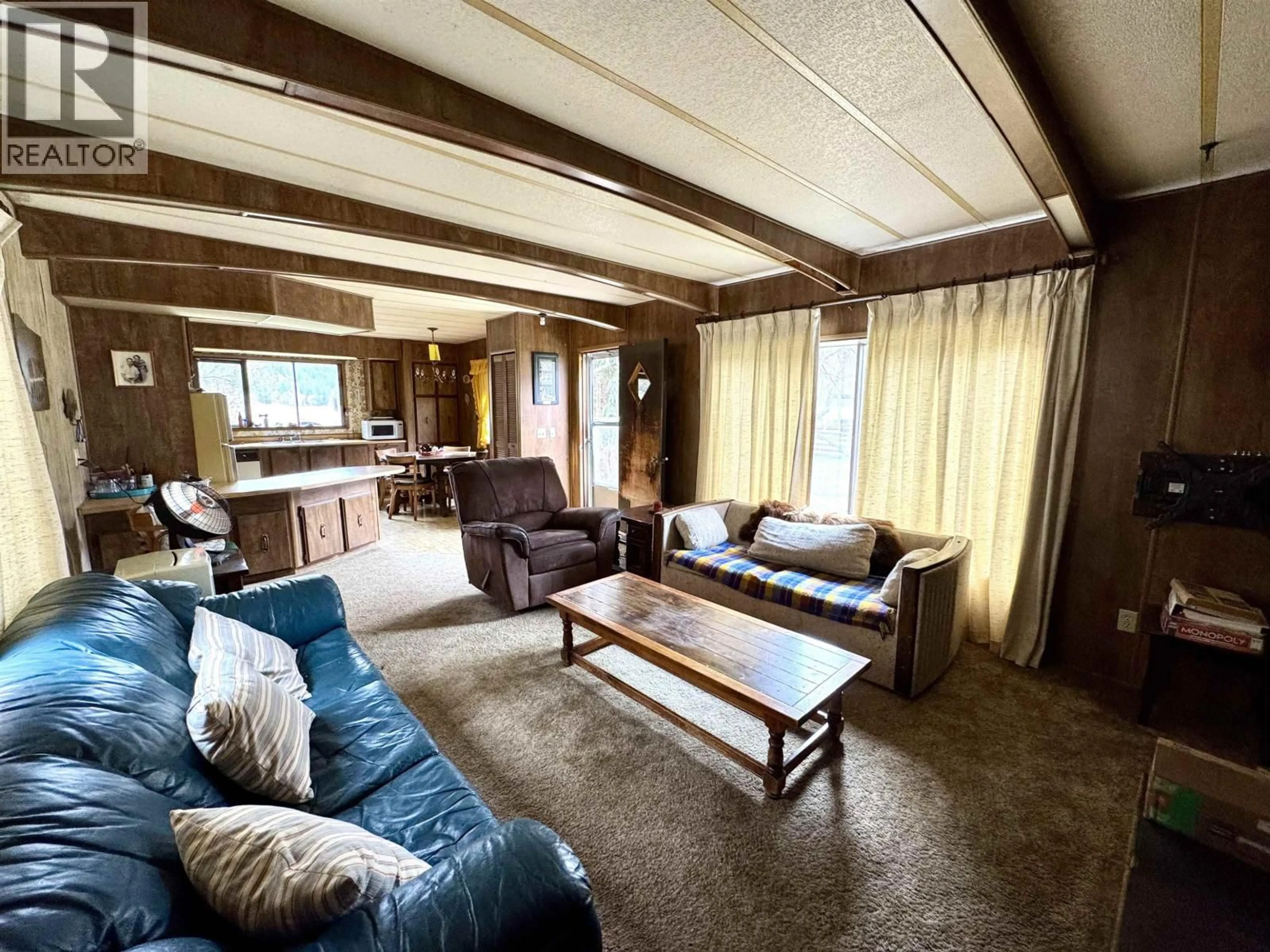 Living room with furniture, wood/laminate floor for 6669 SODA CREEK-MACALISTER ROAD, McLeese Lake British Columbia V0L1P0