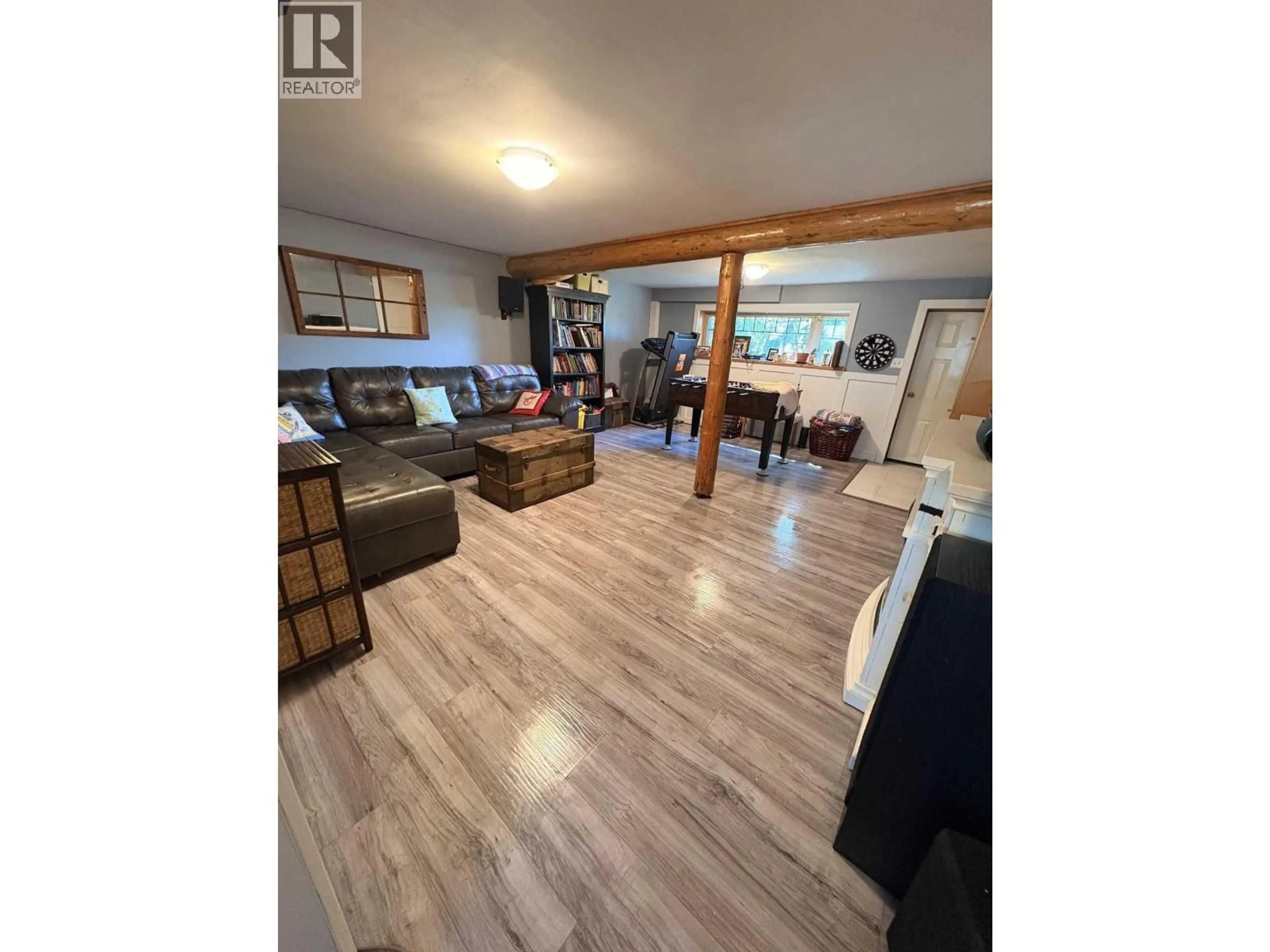 Living room with furniture, wood/laminate floor for 330 REID DRIVE, Vanderhoof British Columbia V0J3A2