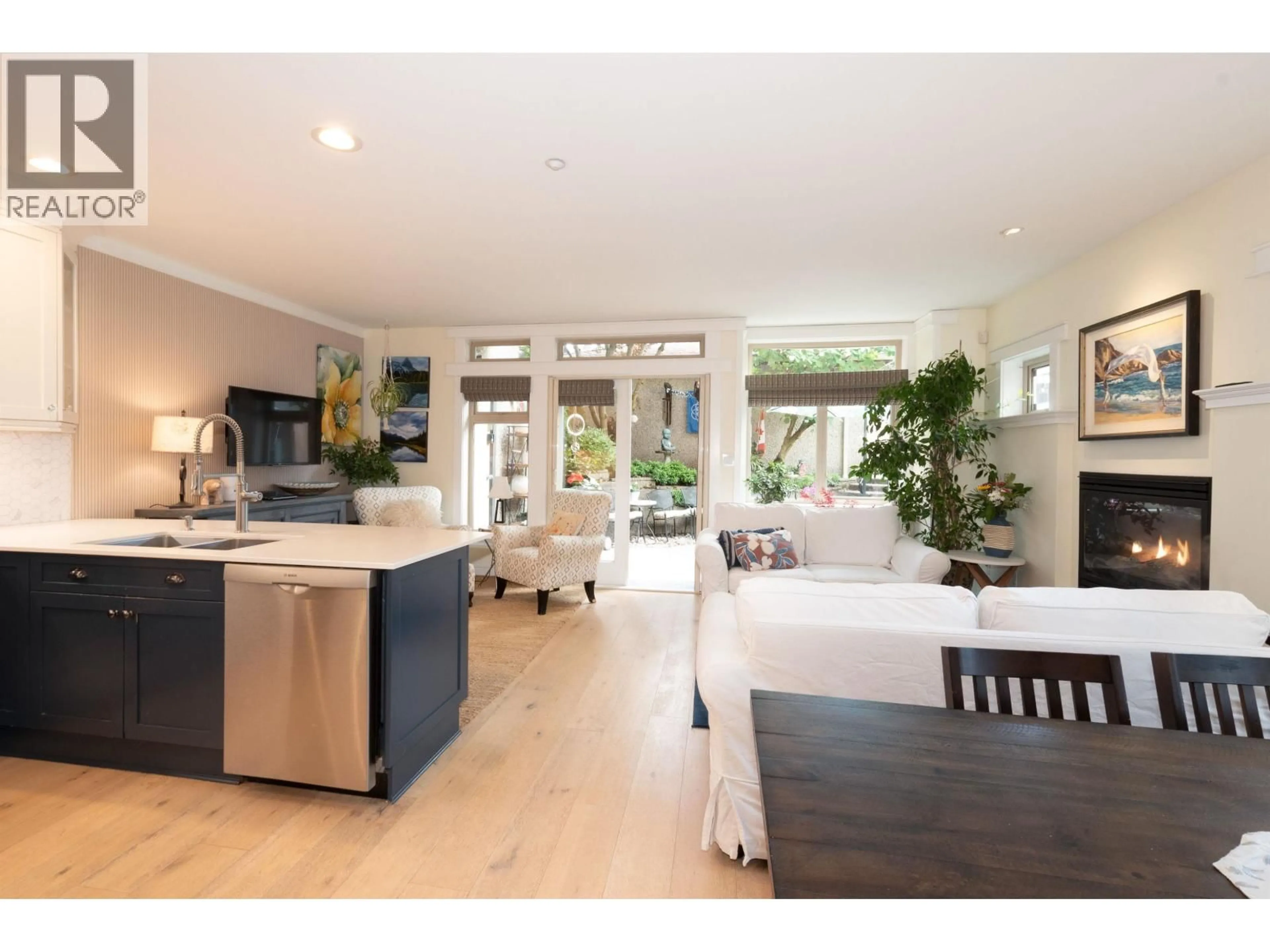 Open concept kitchen, wood/laminate floor for 1978 12TH AVENUE, Vancouver British Columbia V6J2E9