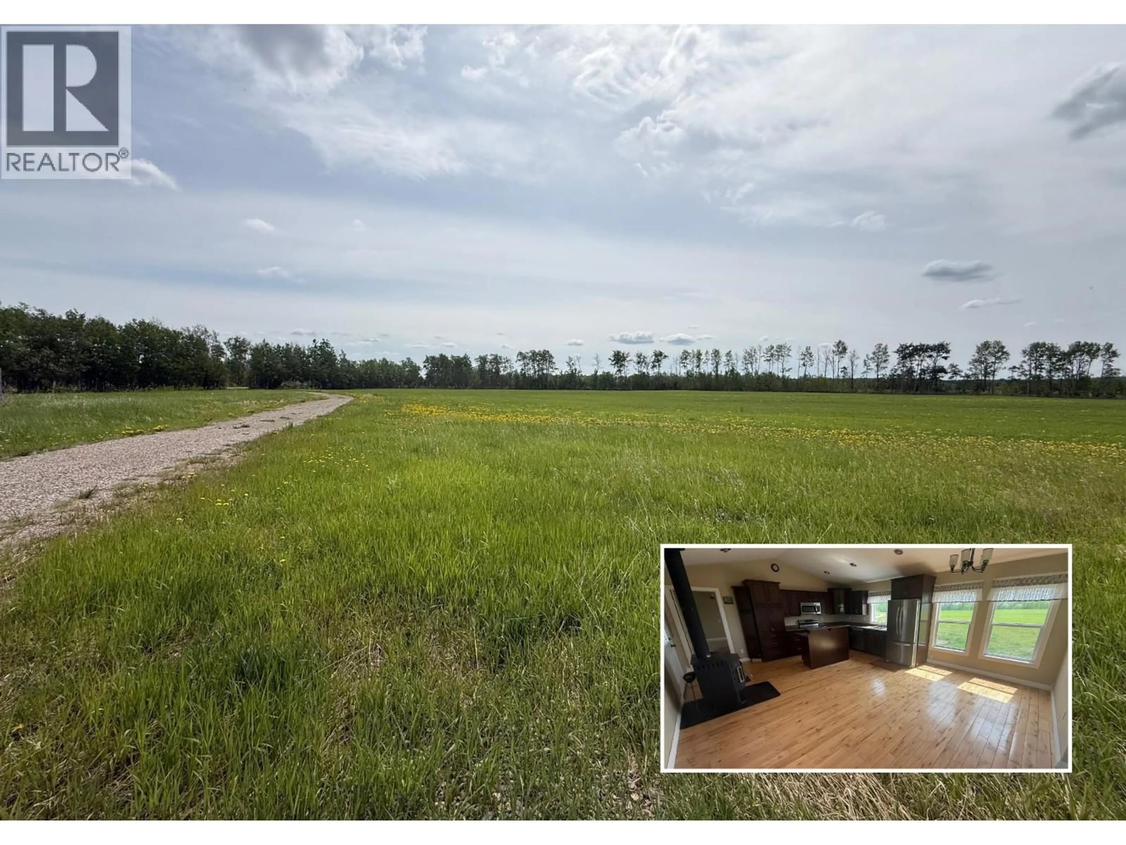 A pic from outside/outdoor area/front of a property/back of a property/a pic from drone, water/lake/river/ocean view for 16412 265 ROAD, Fort St. John British Columbia V0C1Y0