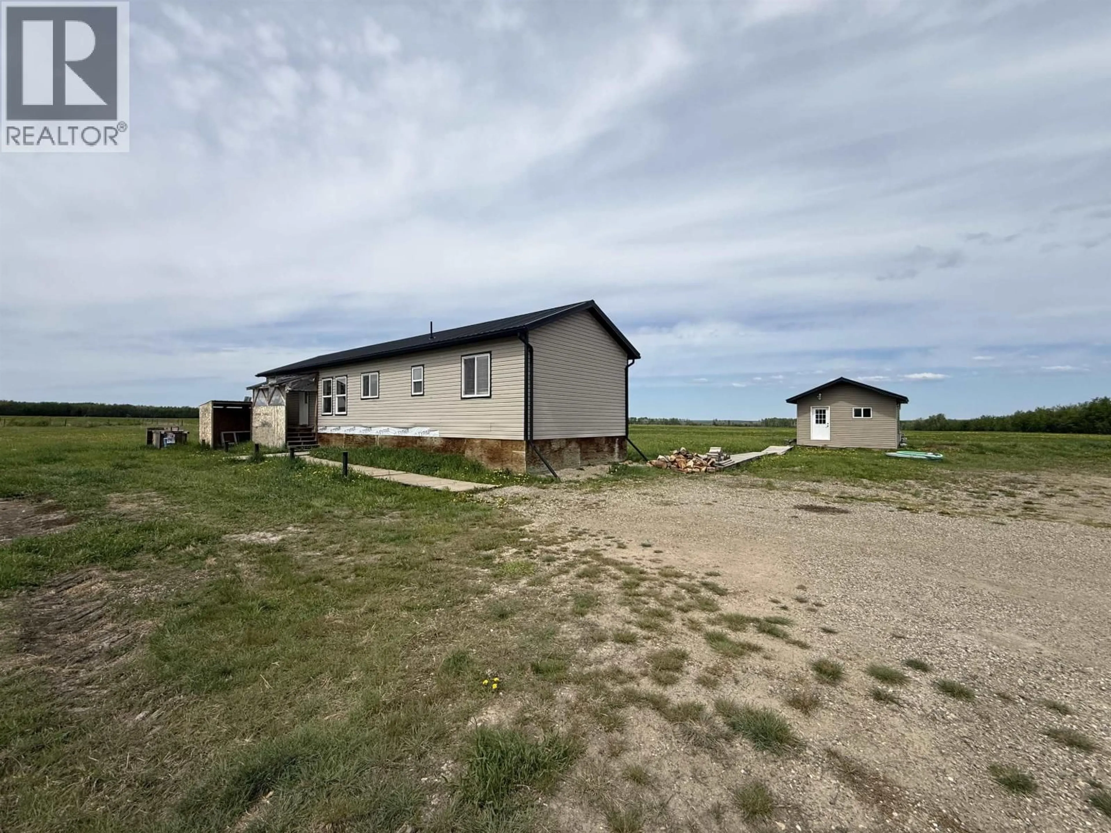 A pic from outside/outdoor area/front of a property/back of a property/a pic from drone, building for 16412 265 ROAD, Fort St. John British Columbia V0C1Y0