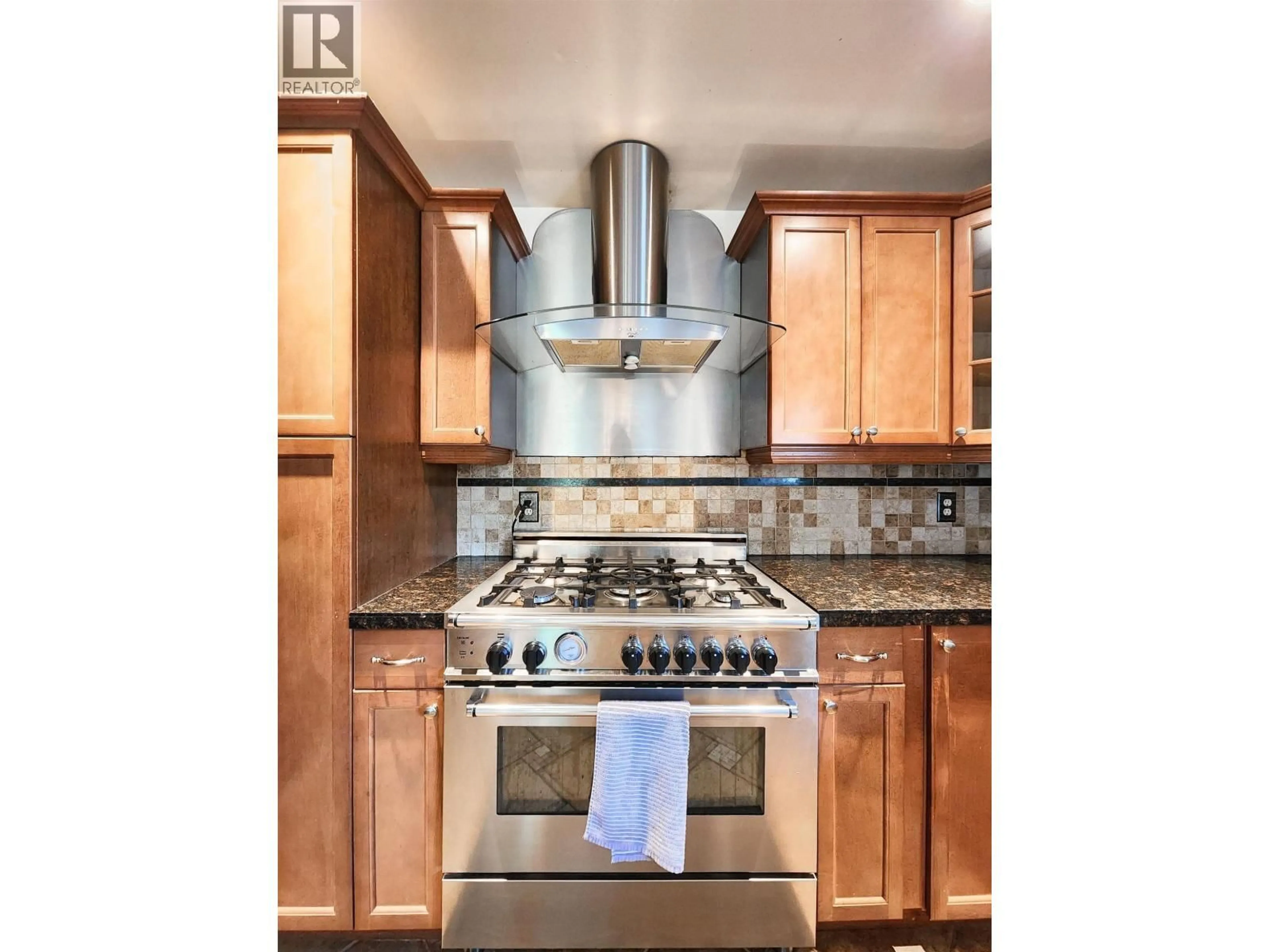 Contemporary kitchen, ceramic/tile floor for 2396 JASPER STREET, Prince George British Columbia V2L1P1