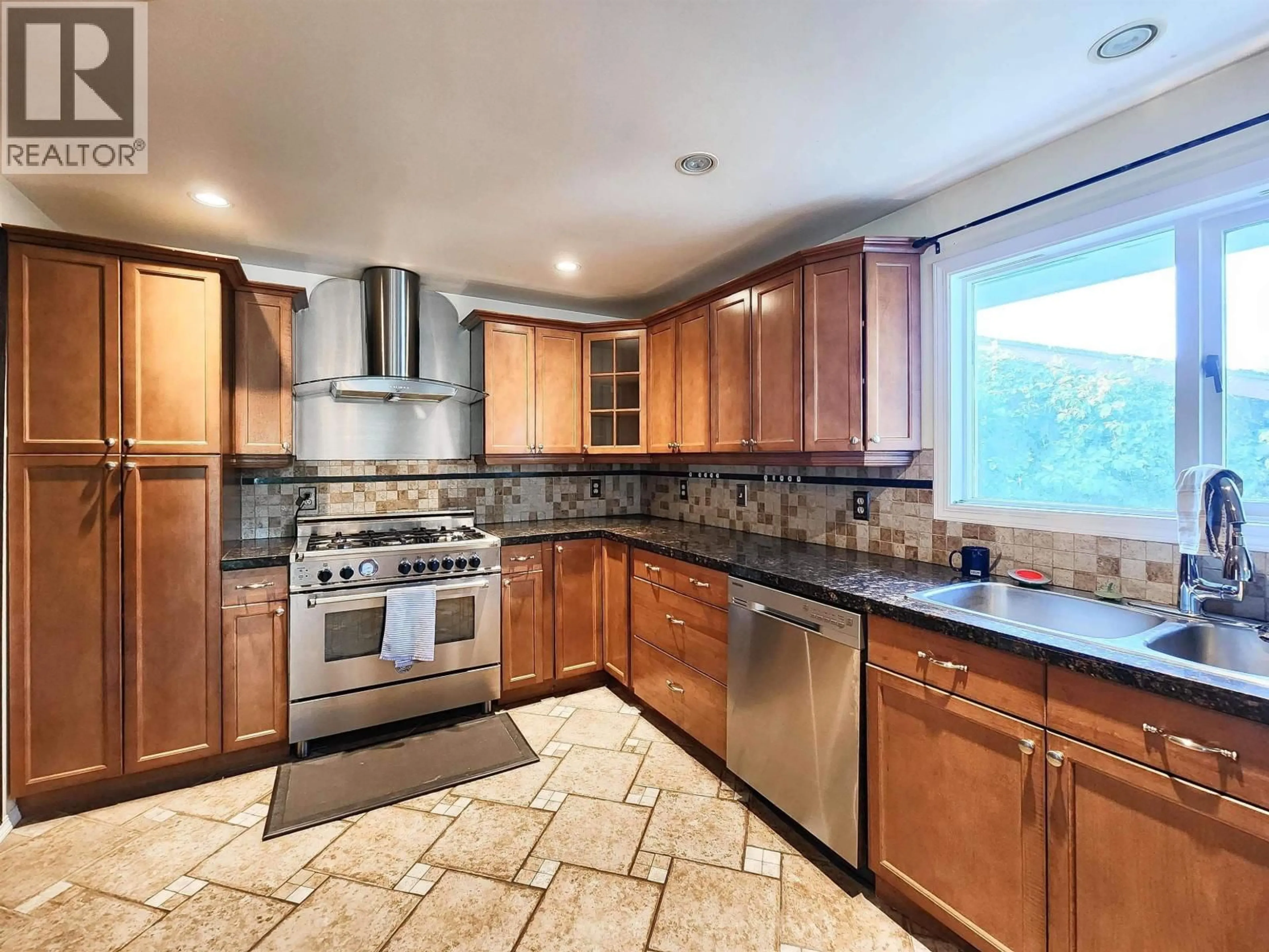 Open concept kitchen, ceramic/tile floor for 2396 JASPER STREET, Prince George British Columbia V2L1P1