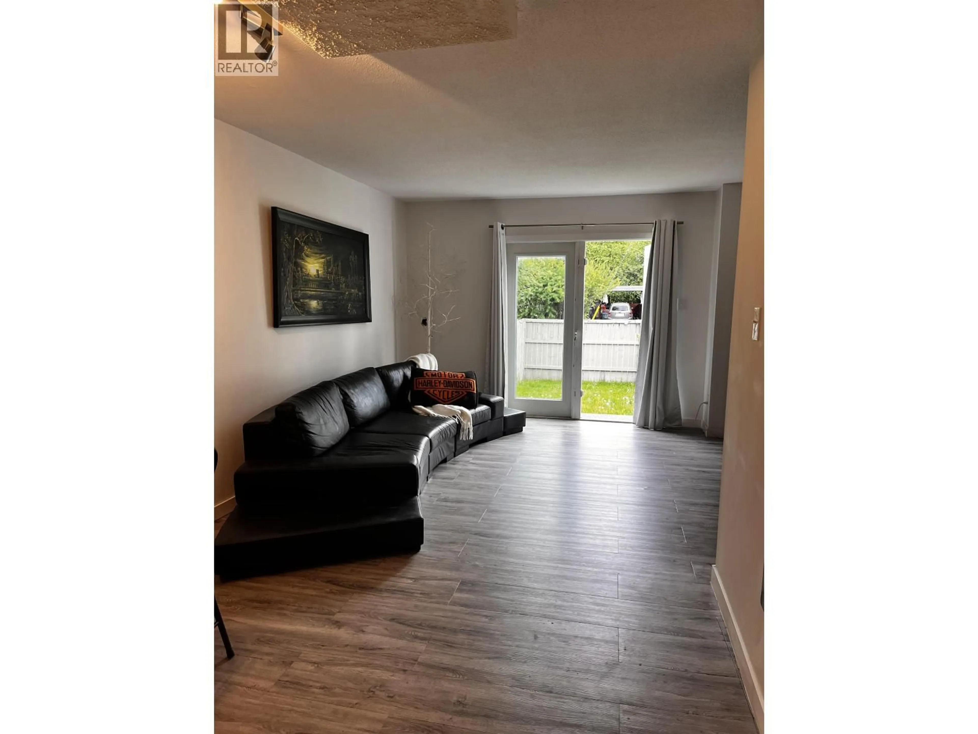 Living room with furniture, wood/laminate floor for 1332 DIEFENBAKER DRIVE, Prince George British Columbia V2L4H7