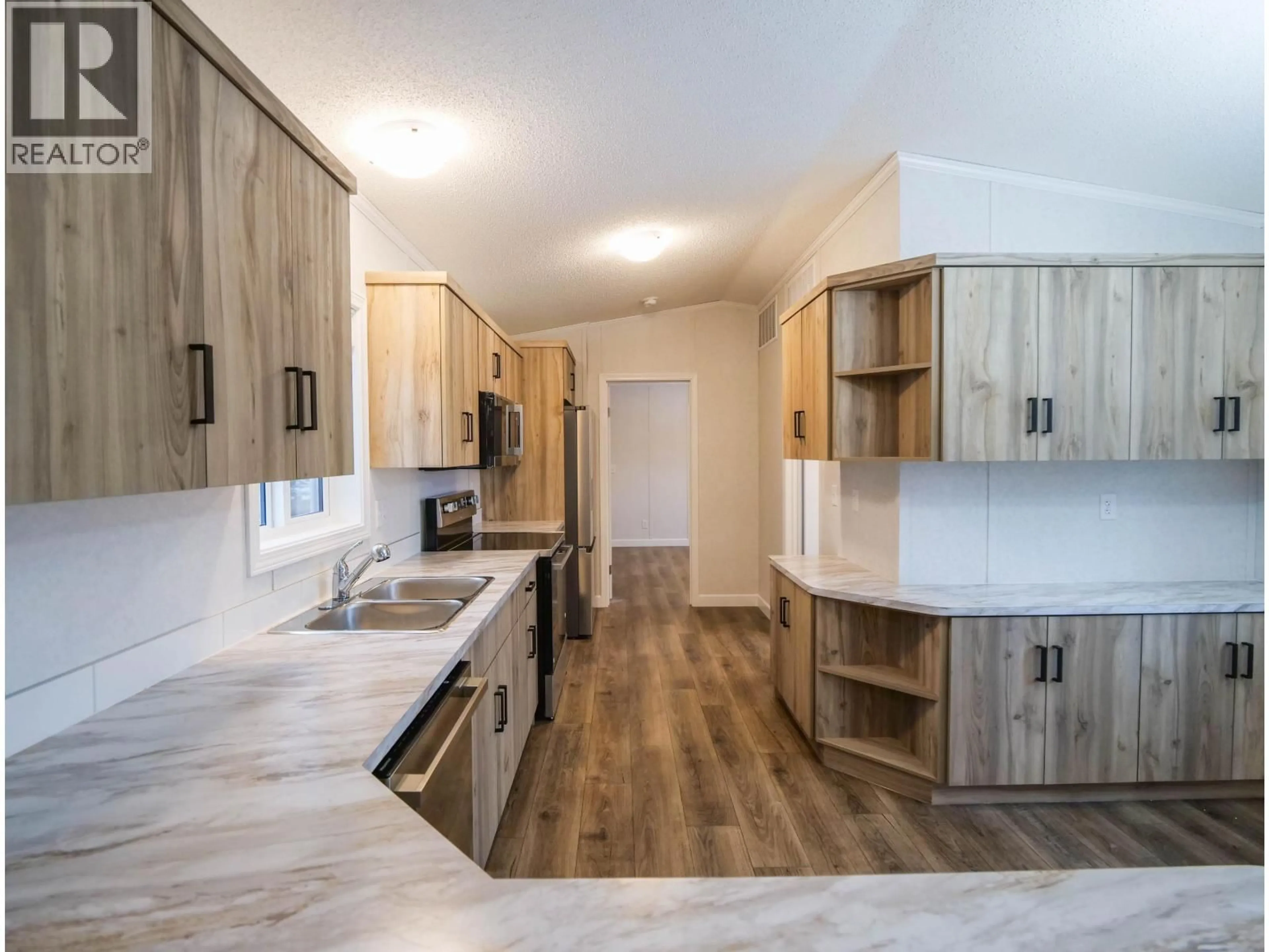 Open concept kitchen, wood/laminate floor for 41 - 602 ELM STREET, Quesnel British Columbia V3J3X1