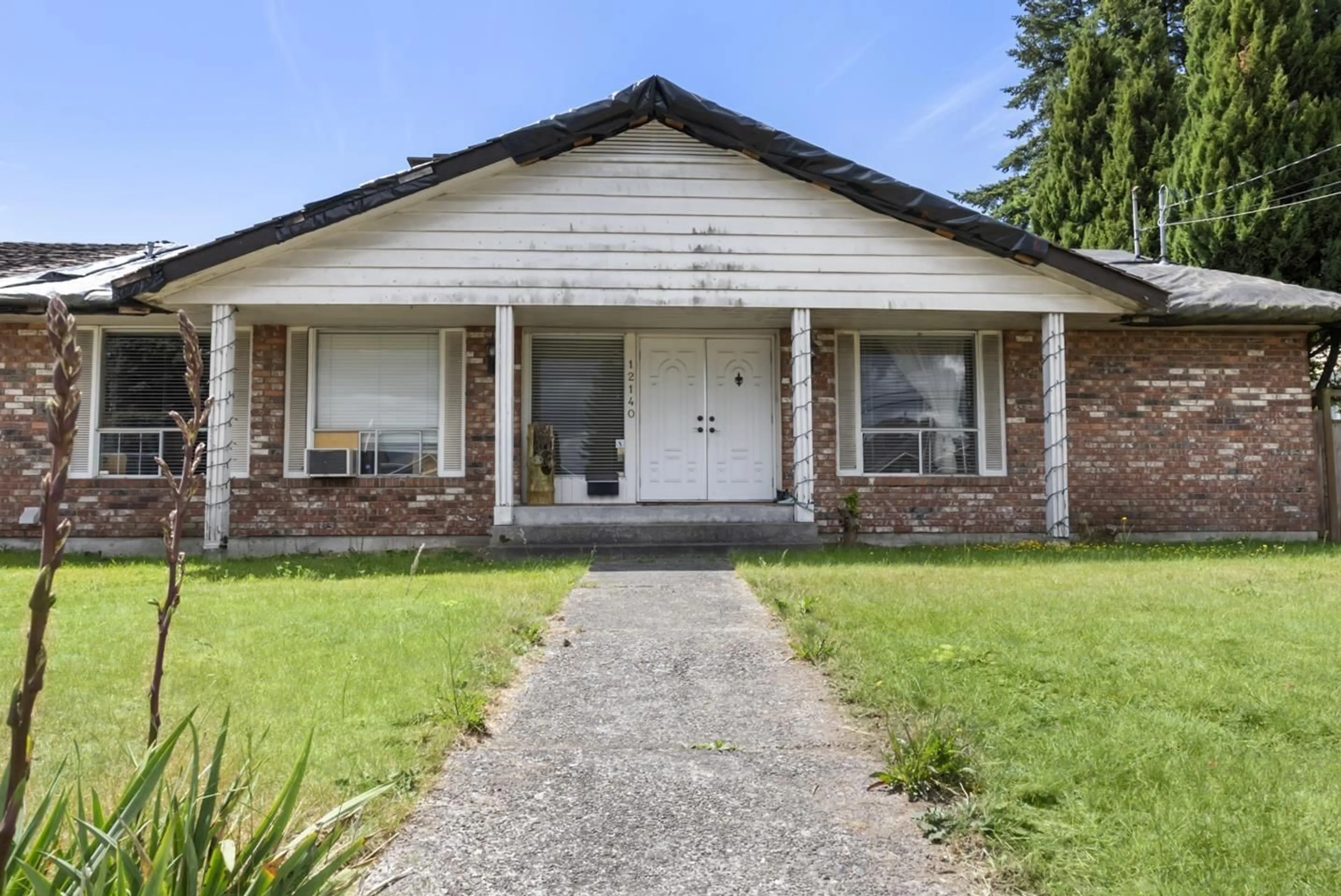 Home with brick exterior material, street for 12140 96 AVENUE, Surrey British Columbia V3V1W4