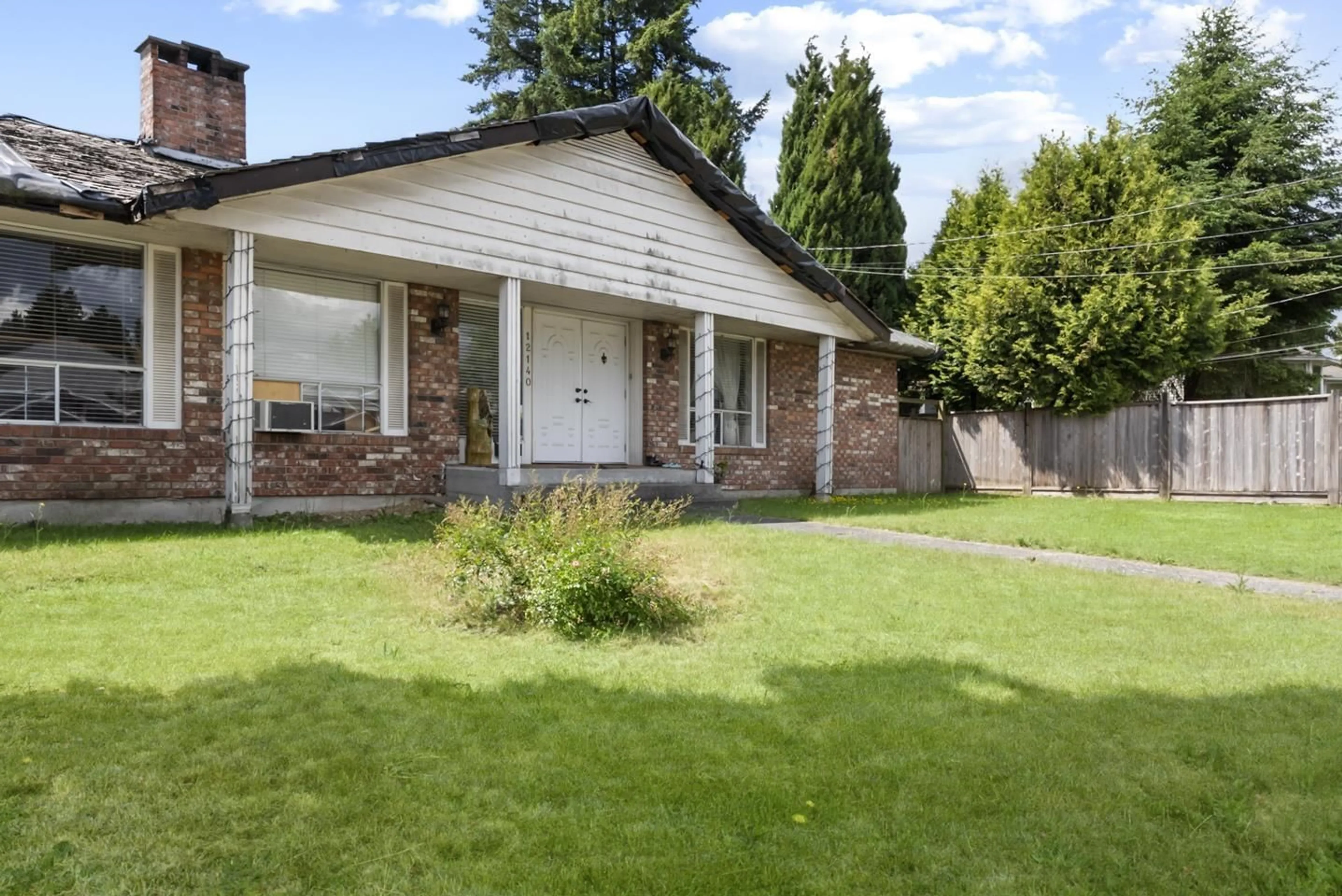 Home with brick exterior material, street for 12140 96 AVENUE, Surrey British Columbia V3V1W4