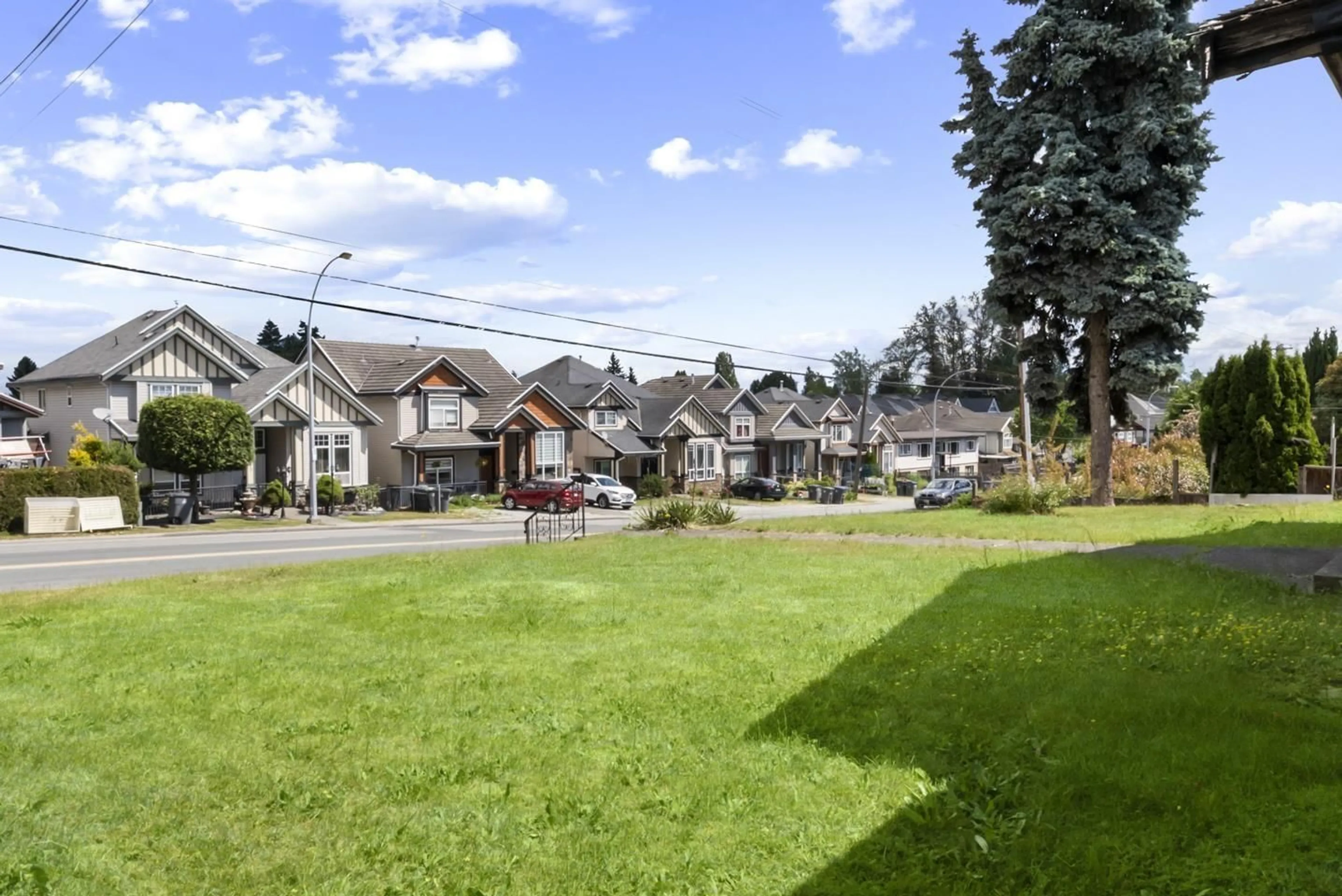 A pic from outside/outdoor area/front of a property/back of a property/a pic from drone, street for 12140 96 AVENUE, Surrey British Columbia V3V1W4