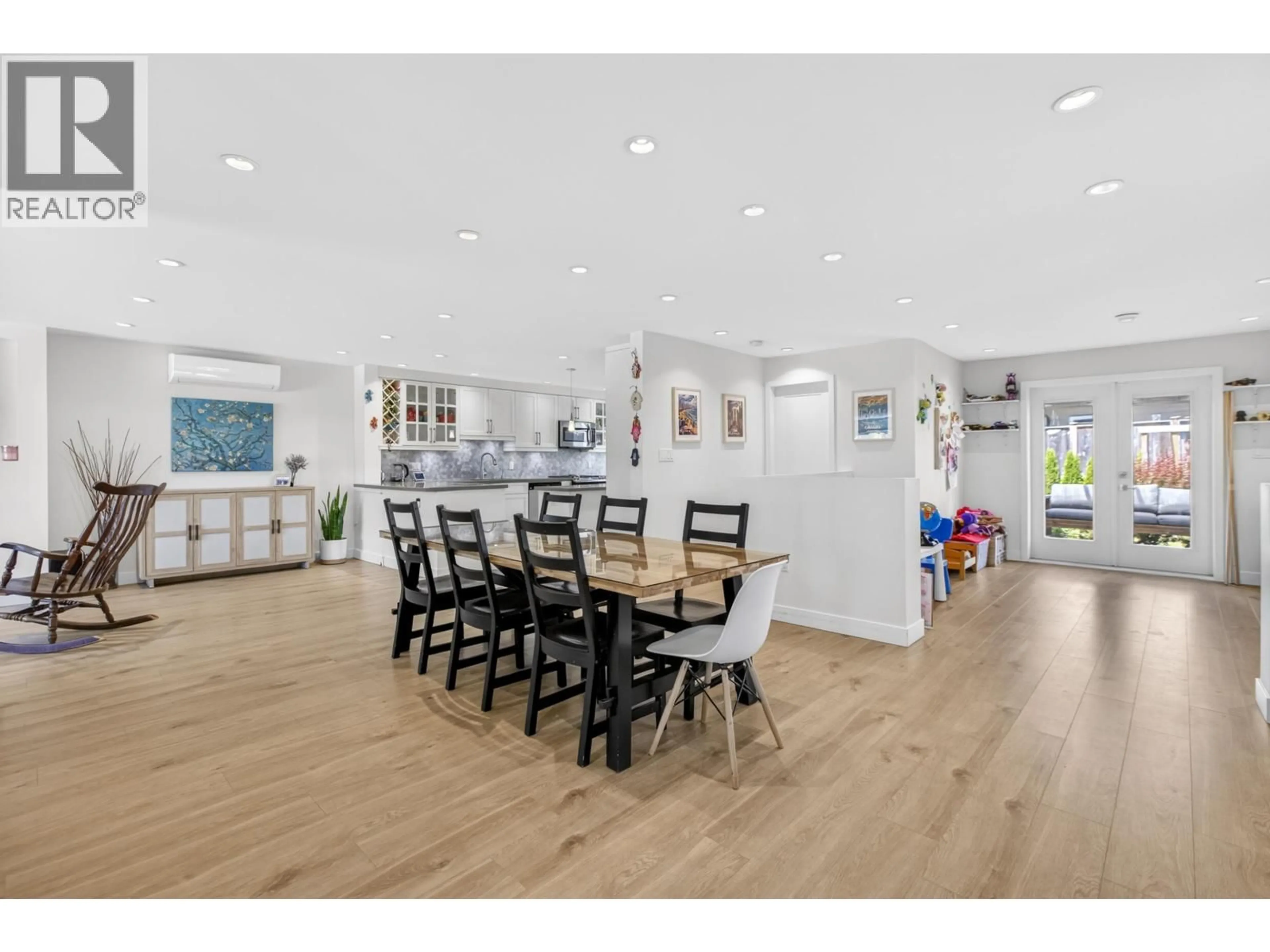 Open concept kitchen, wood/laminate floor for 9851 SWANSEA DRIVE, Richmond British Columbia V7A1N5