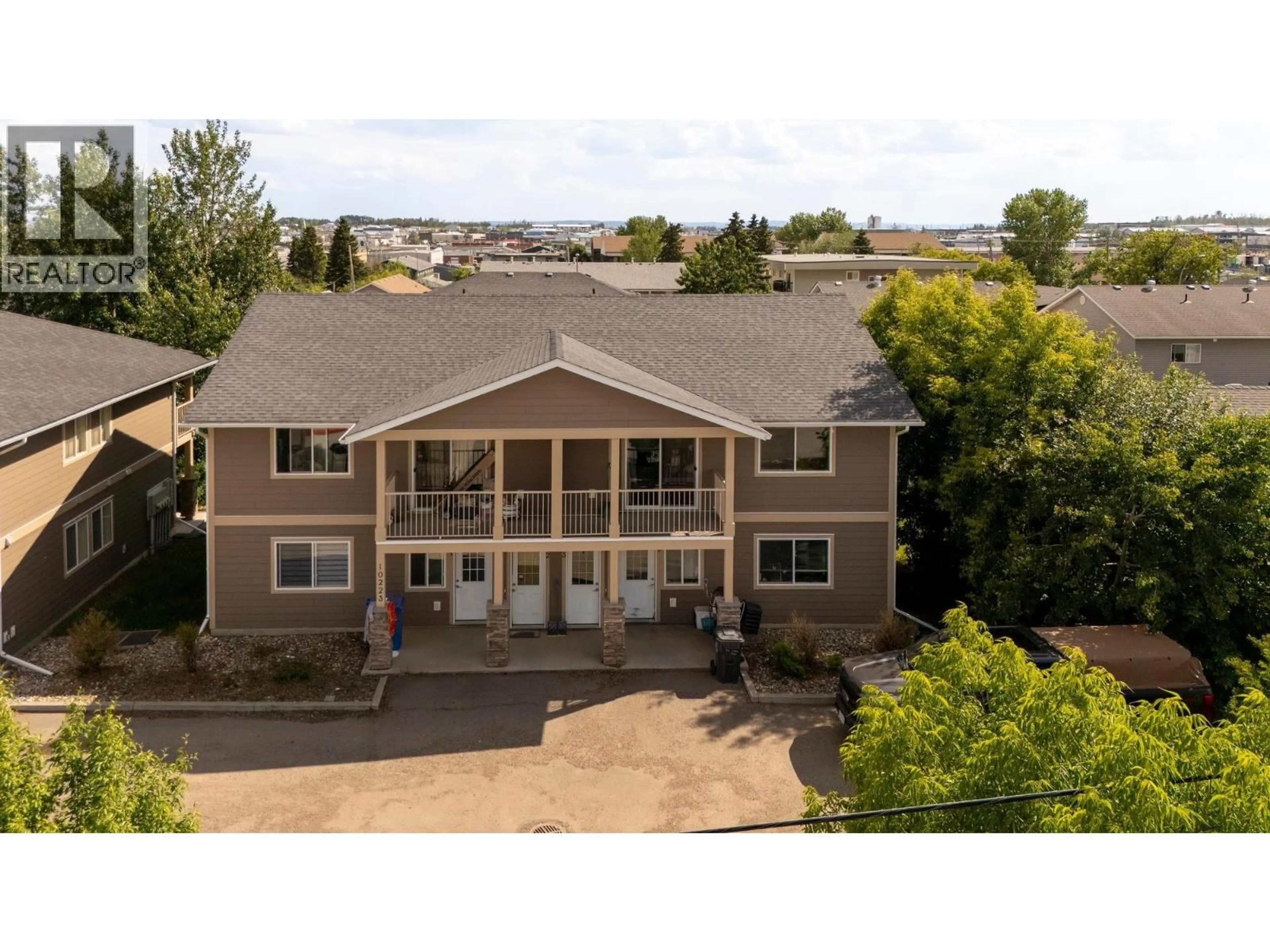 A pic from outside/outdoor area/front of a property/back of a property/a pic from drone, mountain view for 3 - 10223 98 AVENUE, Fort St. John British Columbia V1J0B1